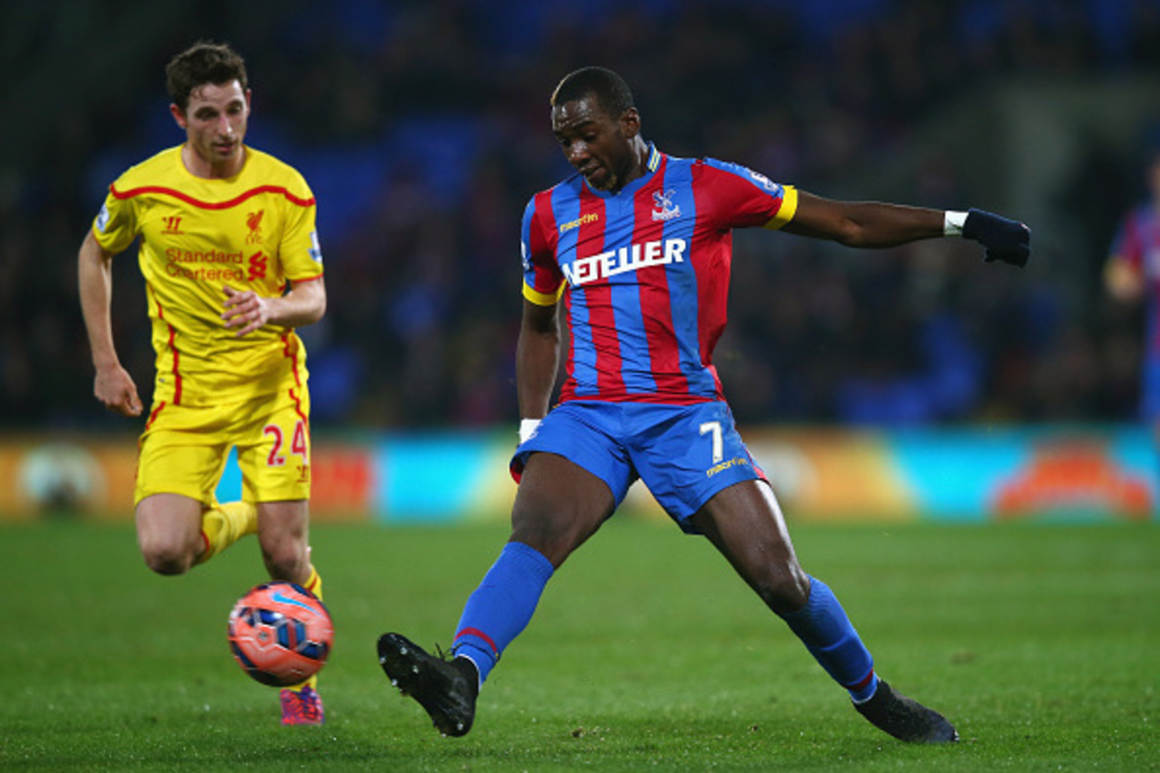 LONDON, ENGLAND - FEBRUARY 14: Joe Allen of Liverpool marshalls Yannick Bolasie of Crystal Palace  during the FA Cup fifth round match between Crystal Palace and Liverpool at Selhurst Park on February 14, 2015 in London, England.  (Photo by Clive Rose/Get