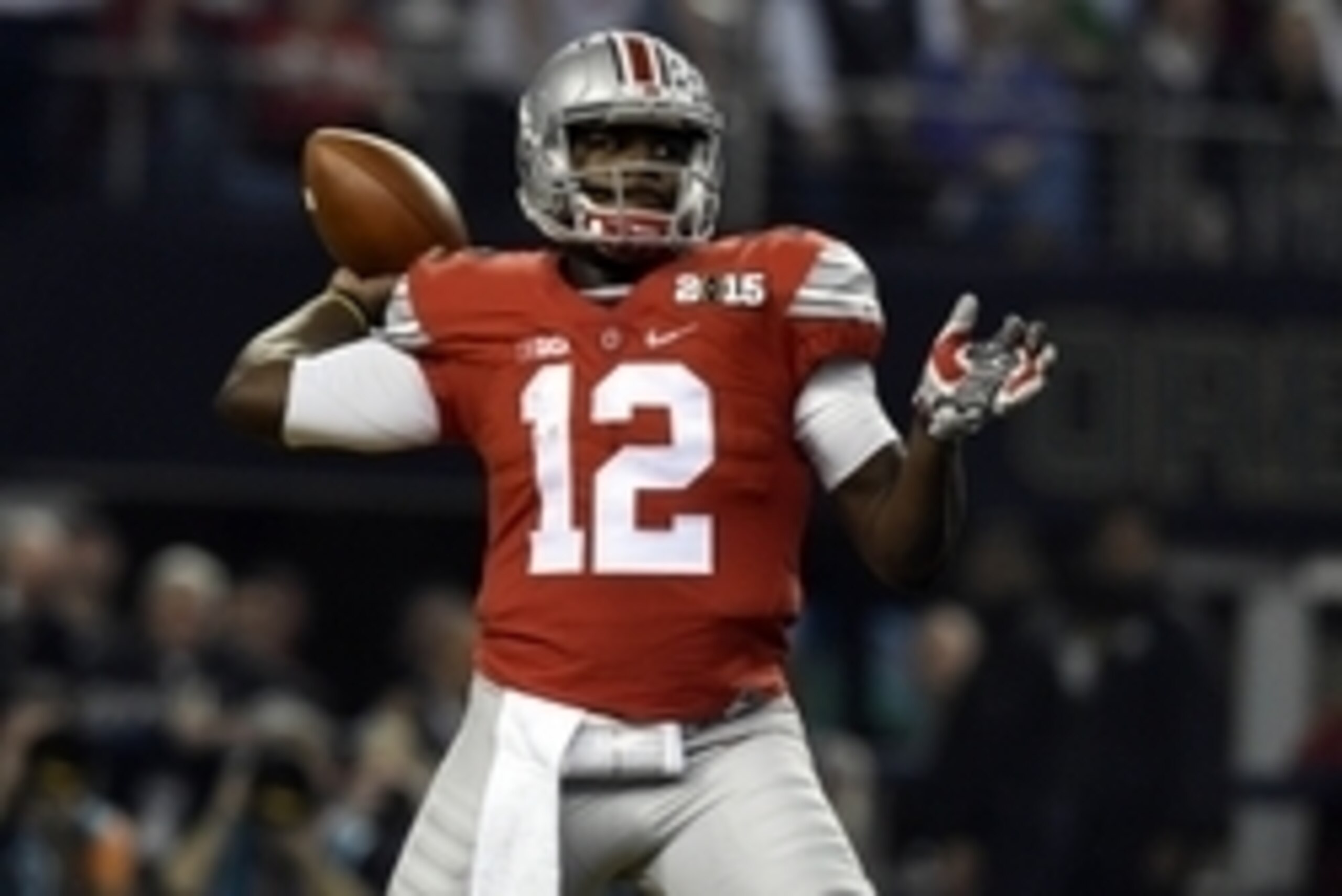 Jan 12, 2015; Arlington, TX, USA; Ohio State Buckeyes quarterback Cardale Jones (12) throws a pass during the first quarter against the Oregon Ducks in the 2015 CFP National Championship Game at AT&T Stadium. Mandatory Credit: Tommy Gilligan-USA TODAY Spo