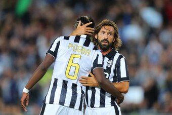 SYDNEY, AUSTRALIA - AUGUST 10: Paul Pogba (L) of Juventus celebrates his goal with Andrea Pirlo of Juventus during the match between the A-League All Stars and Juventus at ANZ Stadium on August 10, 2014 in Sydney, Australia.  (Photo by Joosep Martinson/Ge