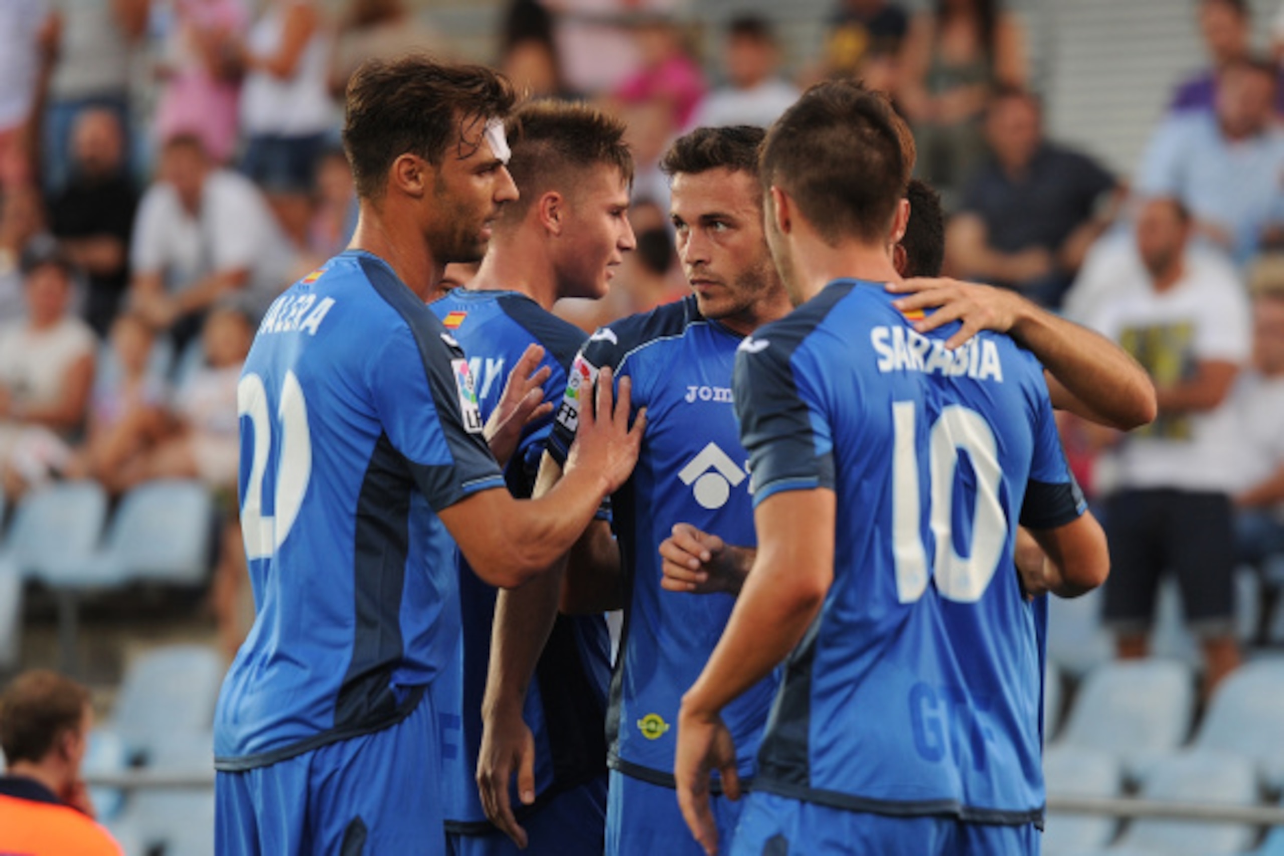 GETAFE, SPAIN - AUGUST 29:  Alvaro Vazquez (C) of Getafe CF celebrates with team mates after scoring his side's opening goal during the La Liga match between Getafe CF and UD Almeria at Coliseum Alfonso Perez on August 29, 2014 in Getafe, Spain.  (Photo b