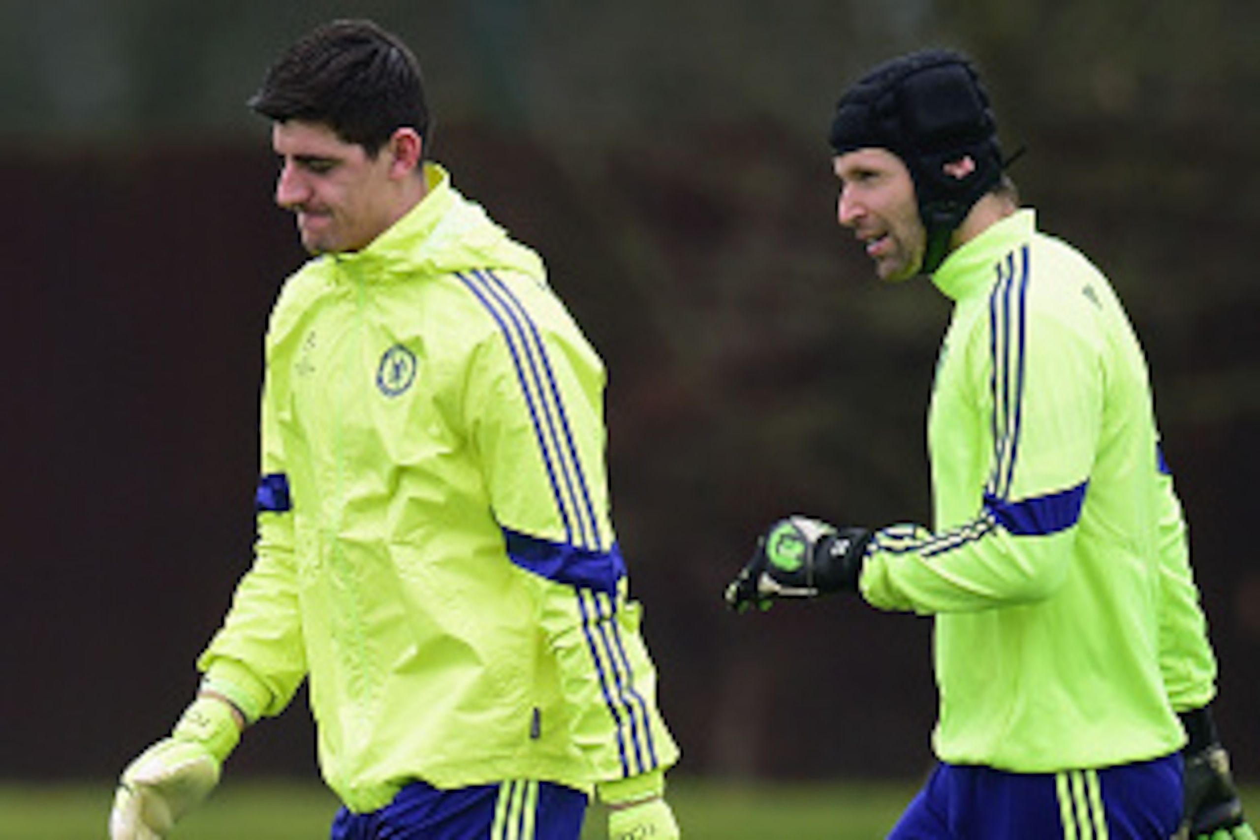 LONDON, ENGLAND - FEBRUARY 16:  Thibaut Courtois and Petr Cech of Chelsea talk during a Chelsea training session ahead of the UEFA Champions League round of 16 match against Paris Saint-Germain at Cobham Training Centre on February 16, 2015 in London, Uni