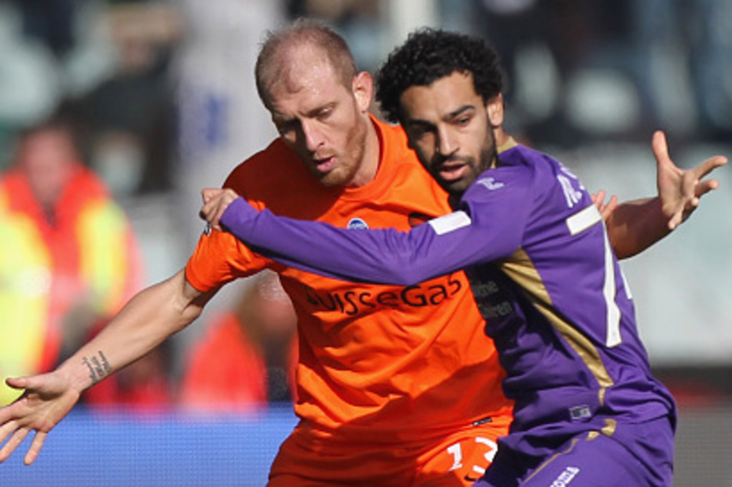 FLORENCE, ITALY - FEBRUARY 08:  Andrea Masiello of Atalanta BC competes for the ball with Mohamed Salah (R) of ACF Fiorentina during the Serie A match between ACF Fiorentina and Atalanta BC at Stadio Artemio Franchi on February 8, 2015 in Florence, Italy.