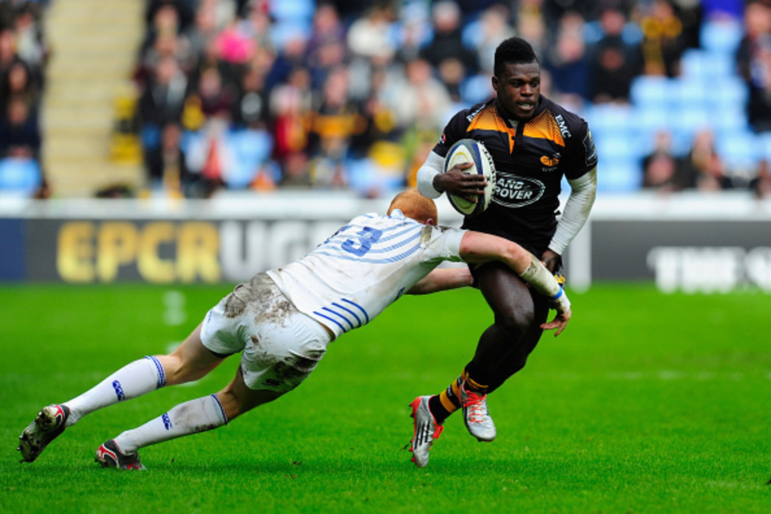 COVENTRY, ENGLAND - JANUARY 24:  Wasps wing Christian Wade runs at Leinster replacement Darragh Fanning during the  European Rugby Champions Cup match between Wasps and Leinster Rugby  at The Ricoh Arena on January 24, 2015 in Coventry, England.  (Photo b