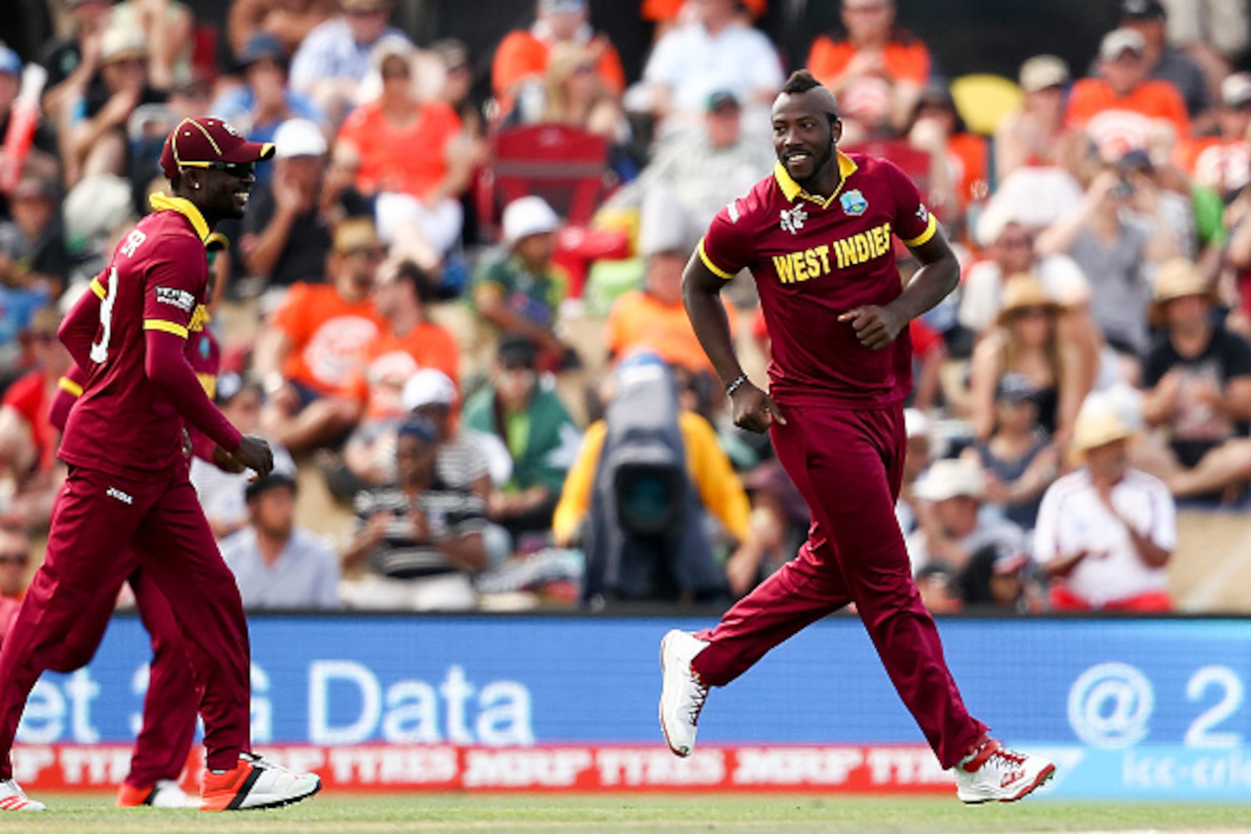 CHRISTCHURCH, NEW ZEALAND - FEBRUARY 21:  Andre Russell (R) of the West Indies celebrates after taking a wicket during the 2015 ICC Cricket World Cup match between Pakistan and the West Indies at Hagley Oval on February 21, 2015 in Christchurch, New Zeala