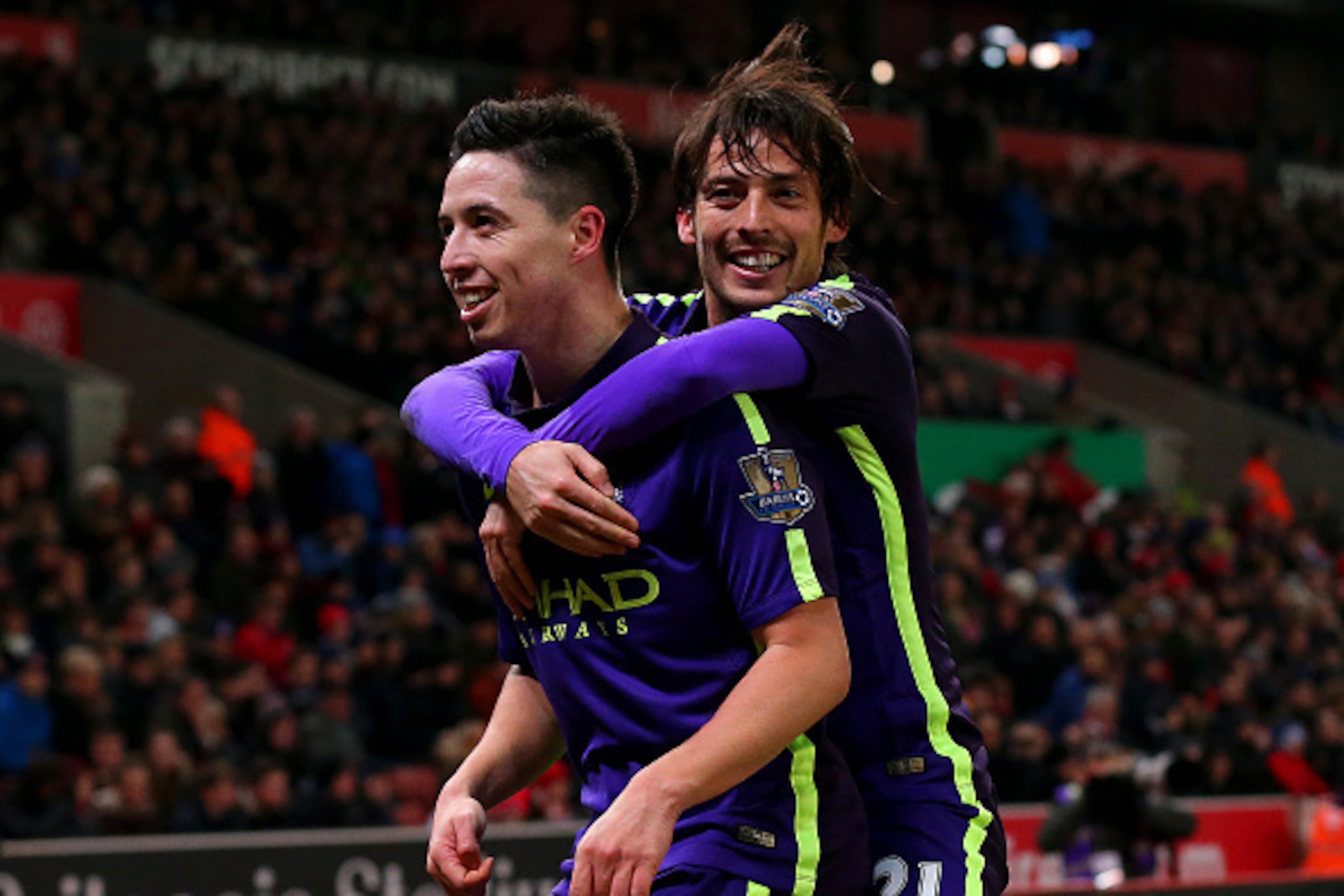 STOKE ON TRENT, ENGLAND - FEBRUARY 11: Samir Nasri of Manchester City celebrates with team-mate David Silva of Manchester City after scoring his team's fourth goal during the Barclays Premier League match between Stoke City and Manchester City at Britann STOKE ON TRENT, ENGLAND - FEBRUARY 11: Samir Nasri of Manchester City celebrates with team-mate David Silva of Manchester City after scoring his team's fourth goal during the Barclays Premier League match between Stoke City and Manchester City at Britann