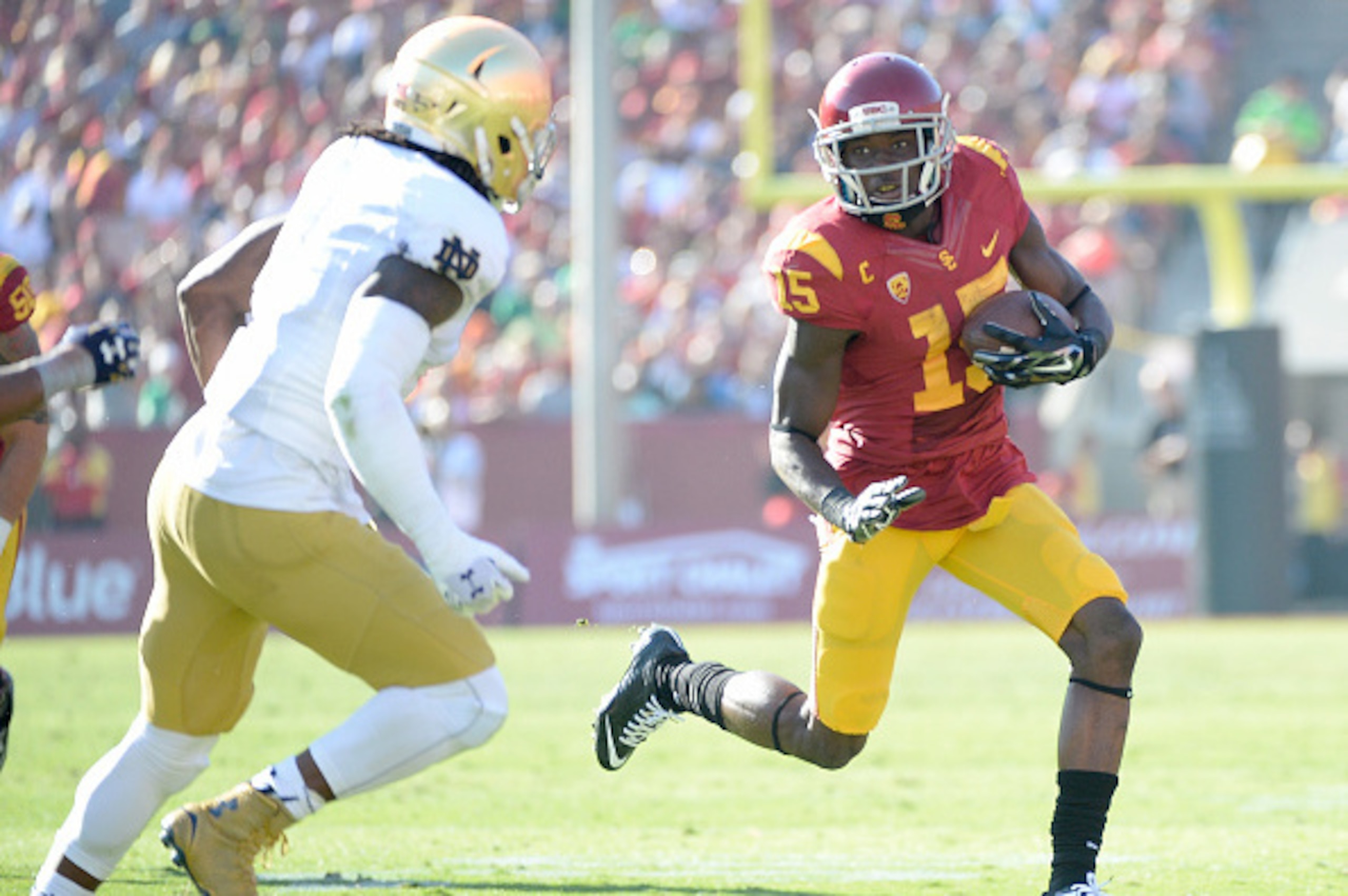 LOS ANGELES, CA - NOVEMBER 29:  Nelson Agholor #15 of the USC Trojans 5at runs after his catch in front of Jaylon Smith #9 of the Notre Dame Fighting Irish Los Angeles Memorial Coliseum on November 29, 2014 in Los Angeles, California.  (Photo by Harry How