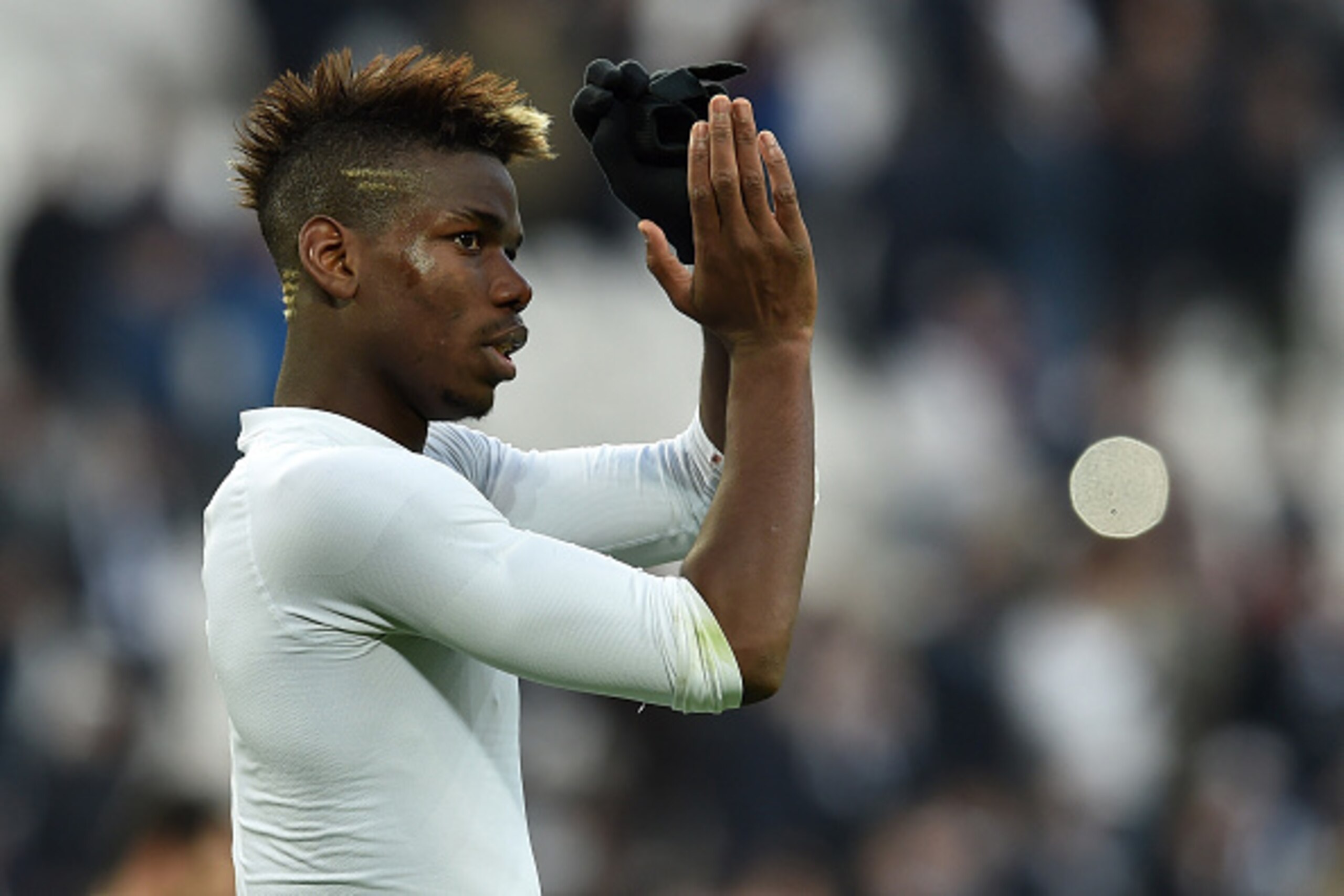 TURIN, ITALY - JANUARY 25:  Paul Pogba of Juventus FC celebrates victory at the end of the Serie A match between Juventus FC and AC Chievo Verona at Juventus Arena on January 25, 2015 in Turin, Italy.  (Photo by Valerio Pennicino/Getty Images)