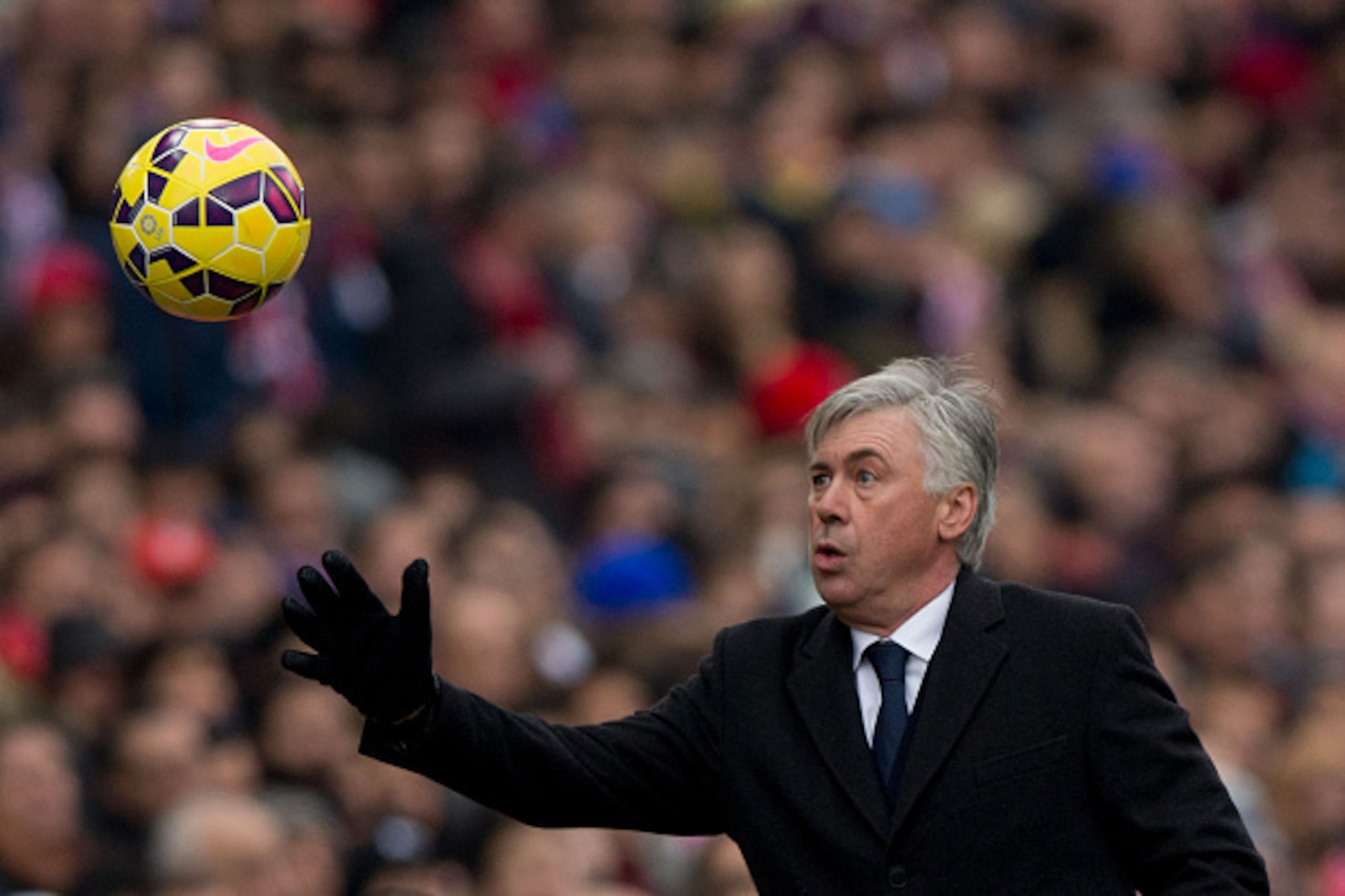 MADRID, SPAIN - FEBRUARY 07:  Head coach Carlo Ancelotti of Real Madrid CF holds the ball during the La Liga match between Club Atletico de Madrid and Real Madrid CF at Vicente Calderon Stadium on February 7, 2015 in Madrid, Spain.  (Photo by Gonzalo Arro