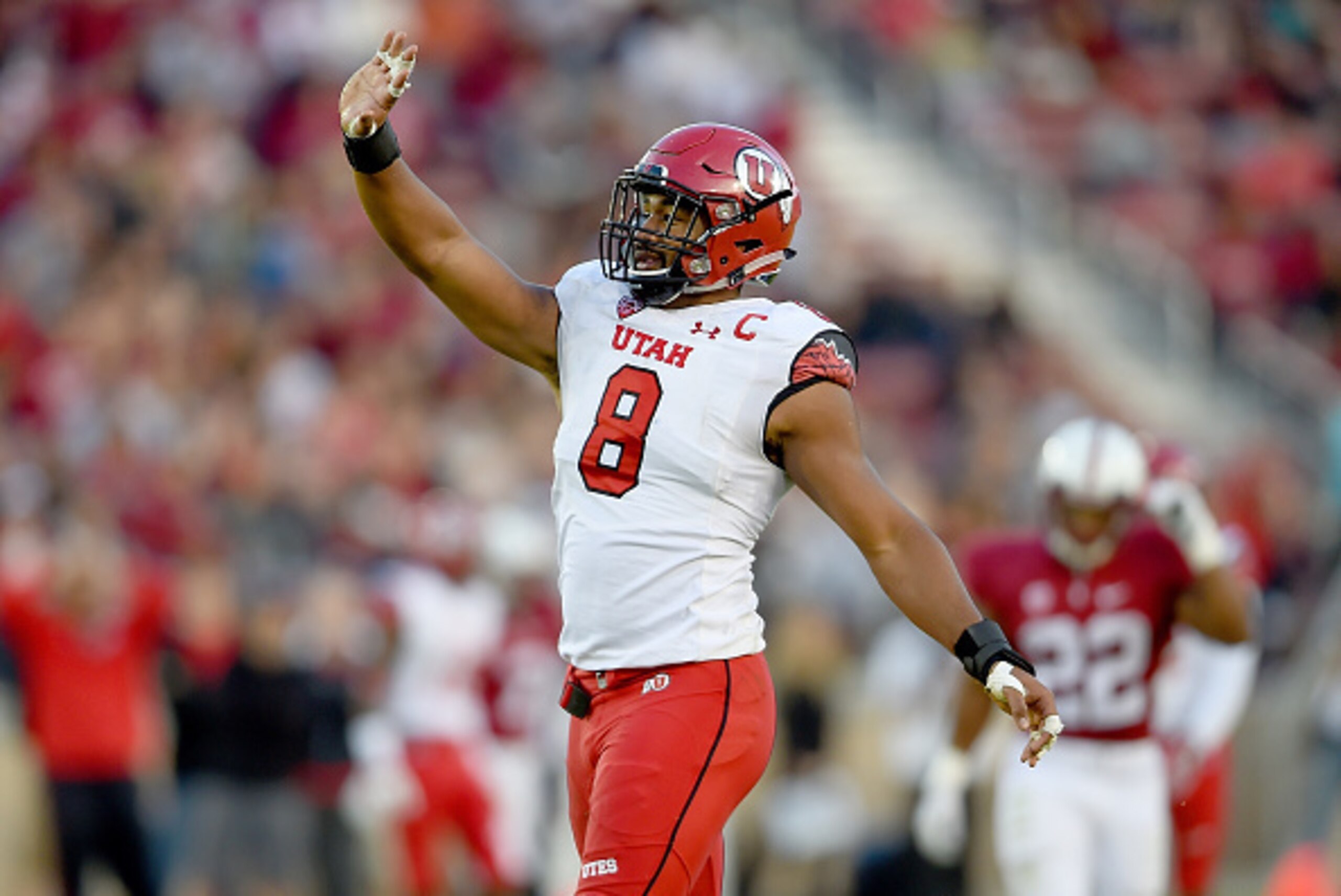 PALO ALTO, CA - NOVEMBER 15:  Nate Orchard #8 of the Utah Utes celebrates after sacking quarterback Kevin Hogan #8 of the Stanford Cardinal in the second quarter at Stanford Stadium on November 15, 2014 in Palo Alto, California.  (Photo by Thearon W. Hend