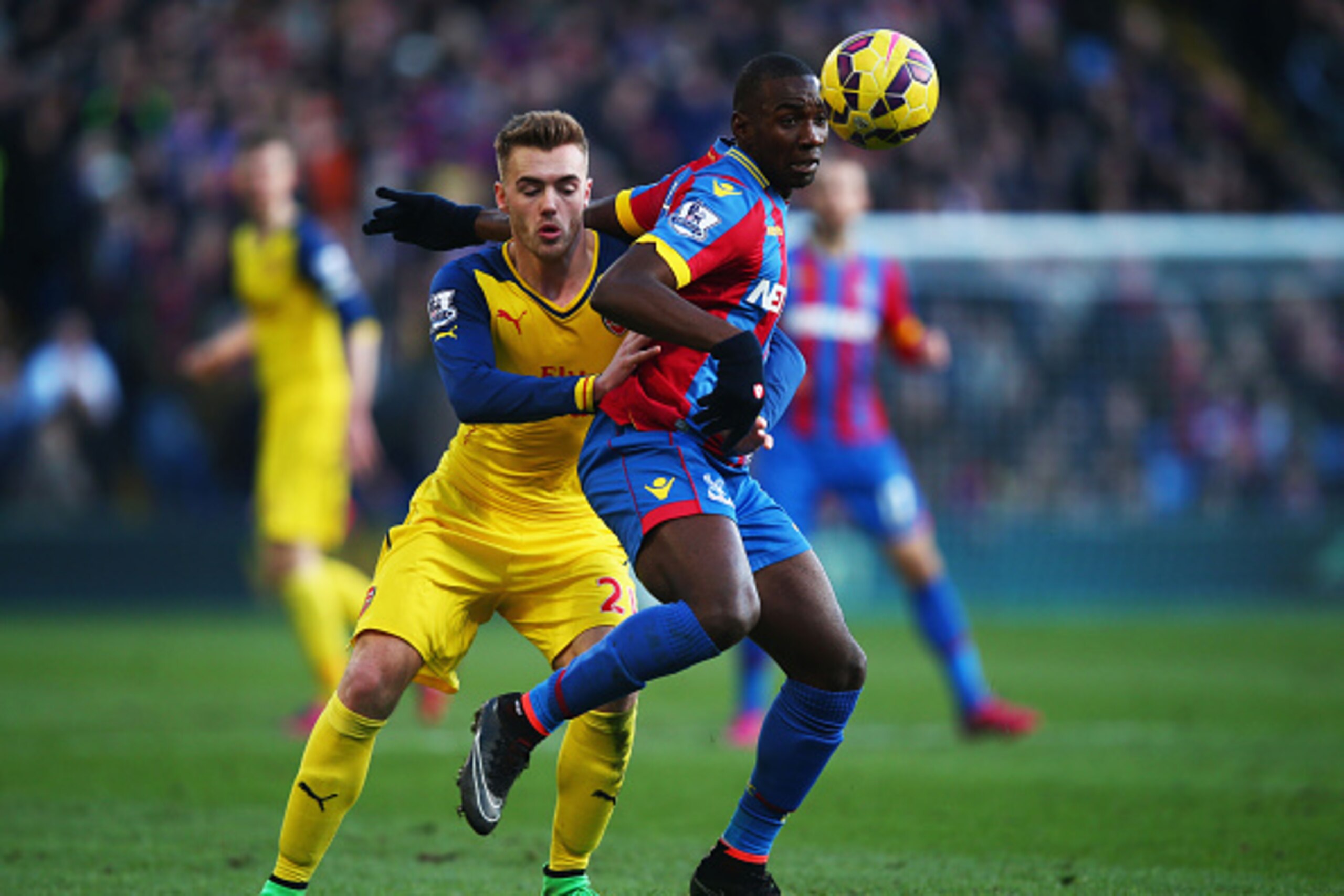 LONDON, ENGLAND - FEBRUARY 21:  Yannick Bolasie of Crystal Palace takes on Calum Chambers of Arsenal during the Barclays Premier League match between Crystal Palace and Arsenal at Selhurst Park on February 21, 2015 in London, England.  (Photo by Clive Ros
