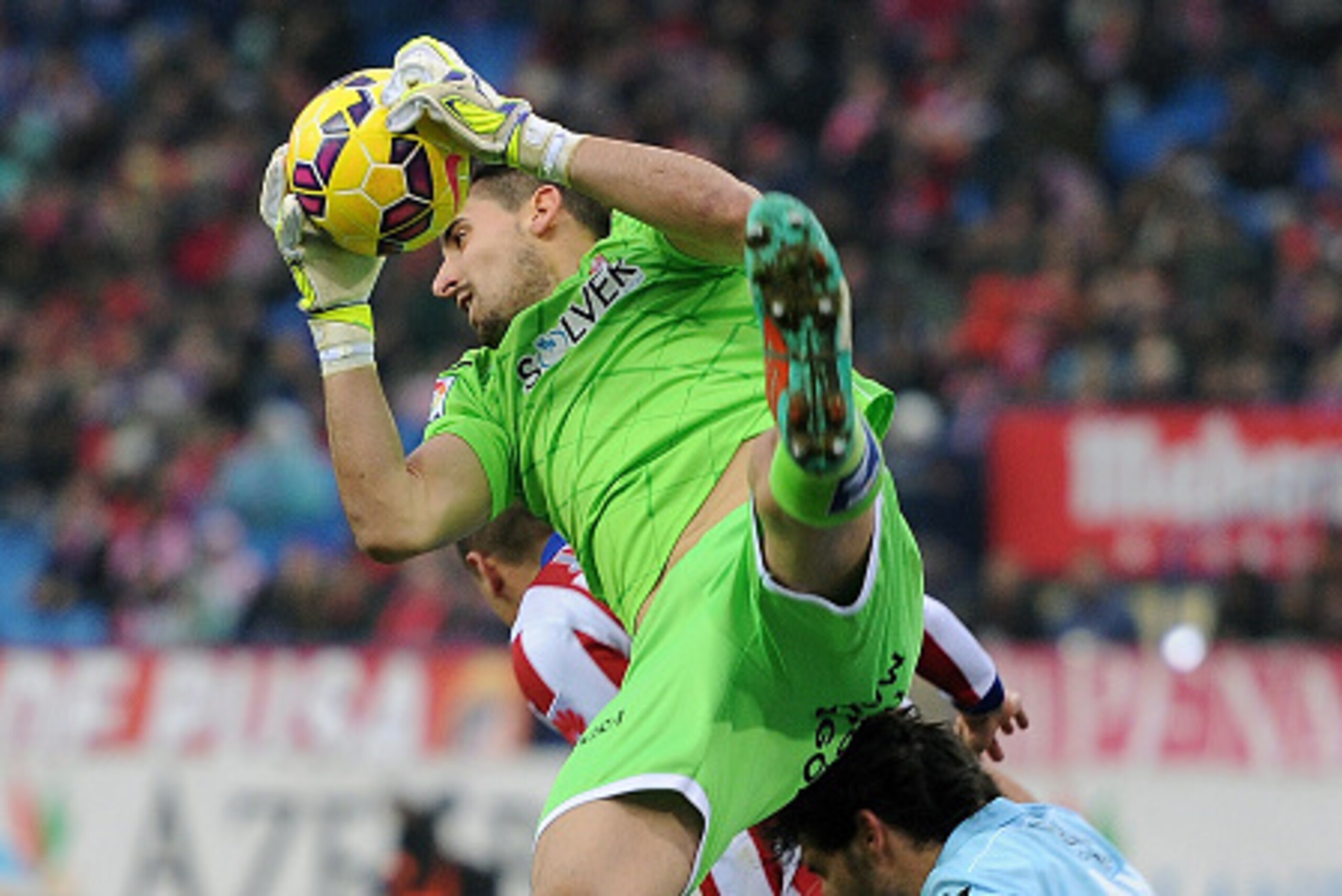 MADRID, SPAIN - JANUARY 18:   Oier Olazabal of Granada CF saves the ball during the La Liga match between Club Atletico de Madrid and Granada CF  at Vicente Calderon Stadium on January 18, 2015 in Madrid, Spain.  (Photo by Denis Doyle/Getty Images)