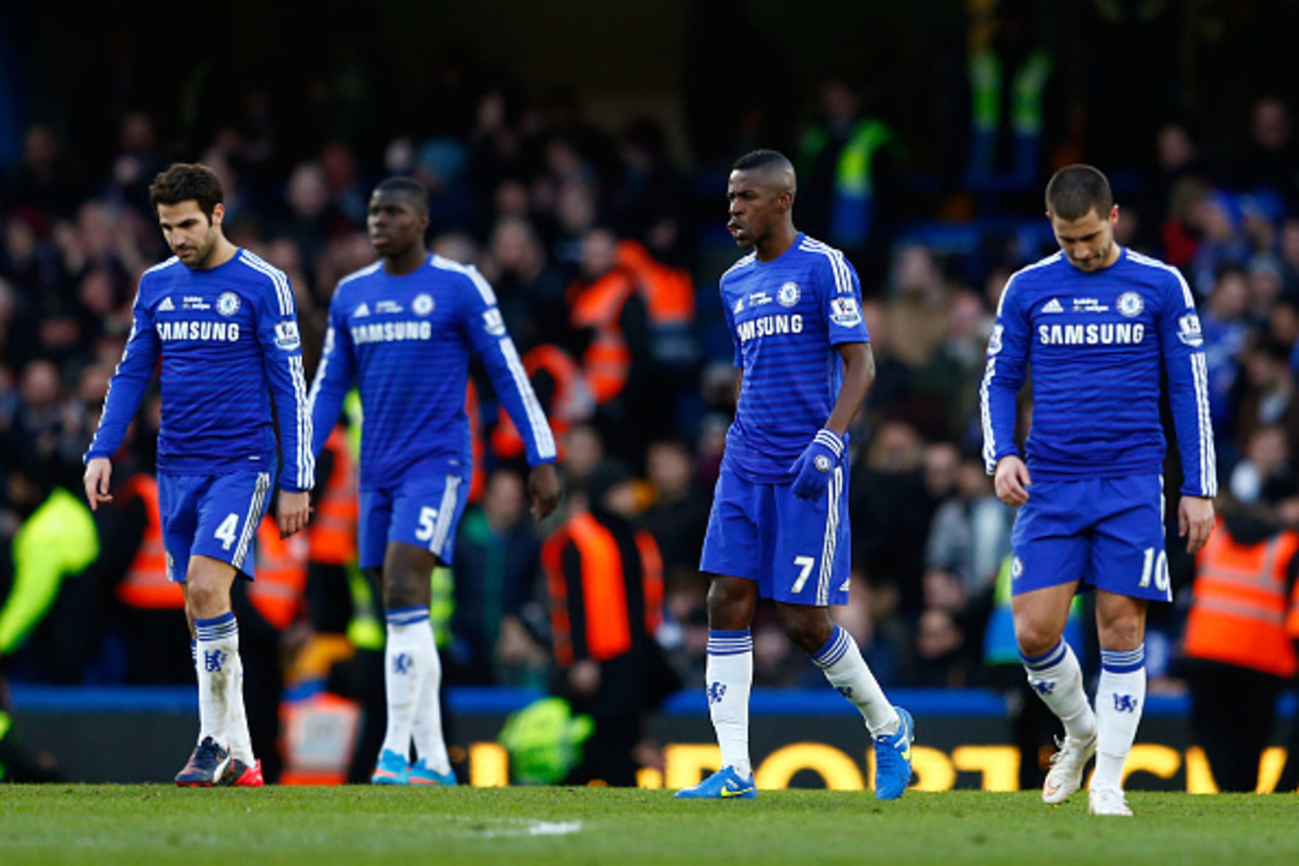 LONDON, ENGLAND - FEBRUARY 21:  Dejected Chelsea players react after conceding the equalising goal during the Barclays Premier League match between Chelsea and Burnley at Stamford Bridge on February 21, 2015 in London, England.  (Photo by Julian Finney/Ge