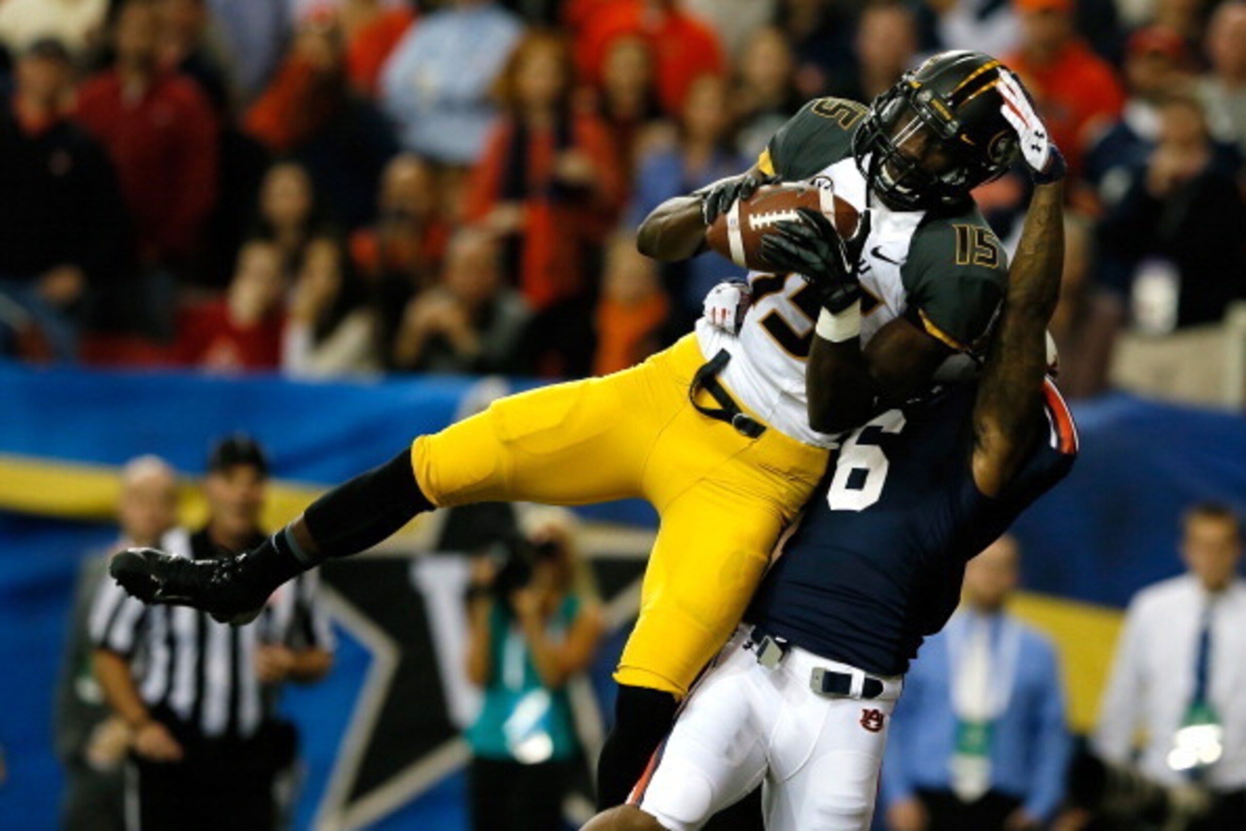 ATLANTA, GA - DECEMBER 07:  Dorial Green-Beckham #15 of the Missouri Tigers scores a touchdown in the first quarter against the Jonathon Mincy #6 of the Auburn Tigers during the SEC Championship Game at Georgia Dome on December 7, 2013 in Atlanta, Georgia