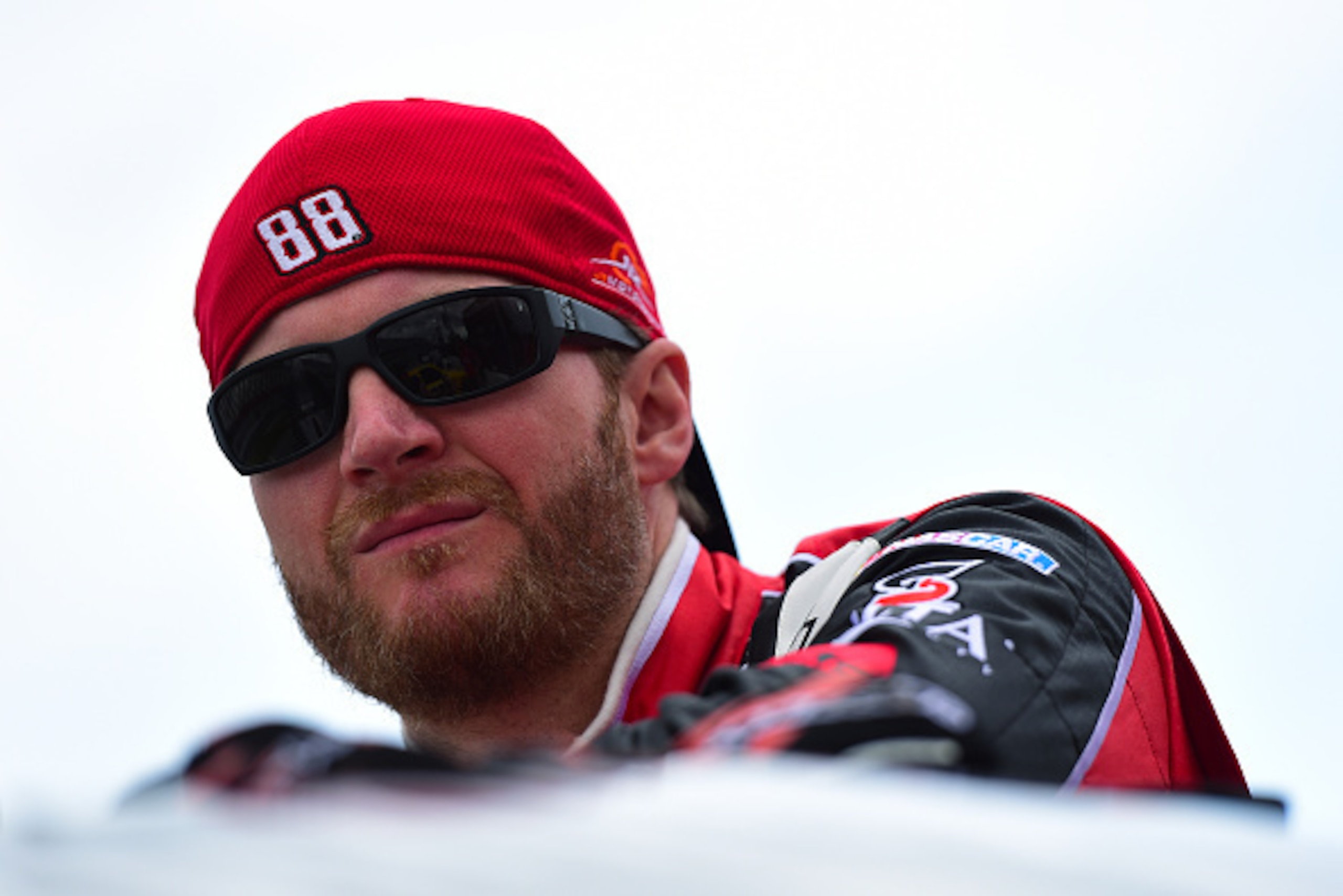 DAYTONA BEACH, FL - FEBRUARY 21:  Dale Earnhardt Jr., driver of the #88 TaxSlayer.com Chevrolet, looks on from the grid during qualifying for the NASCAR XFINITY Series Alert Today Florida 300 at Daytona International Speedway on February 21, 2015 in Dayto