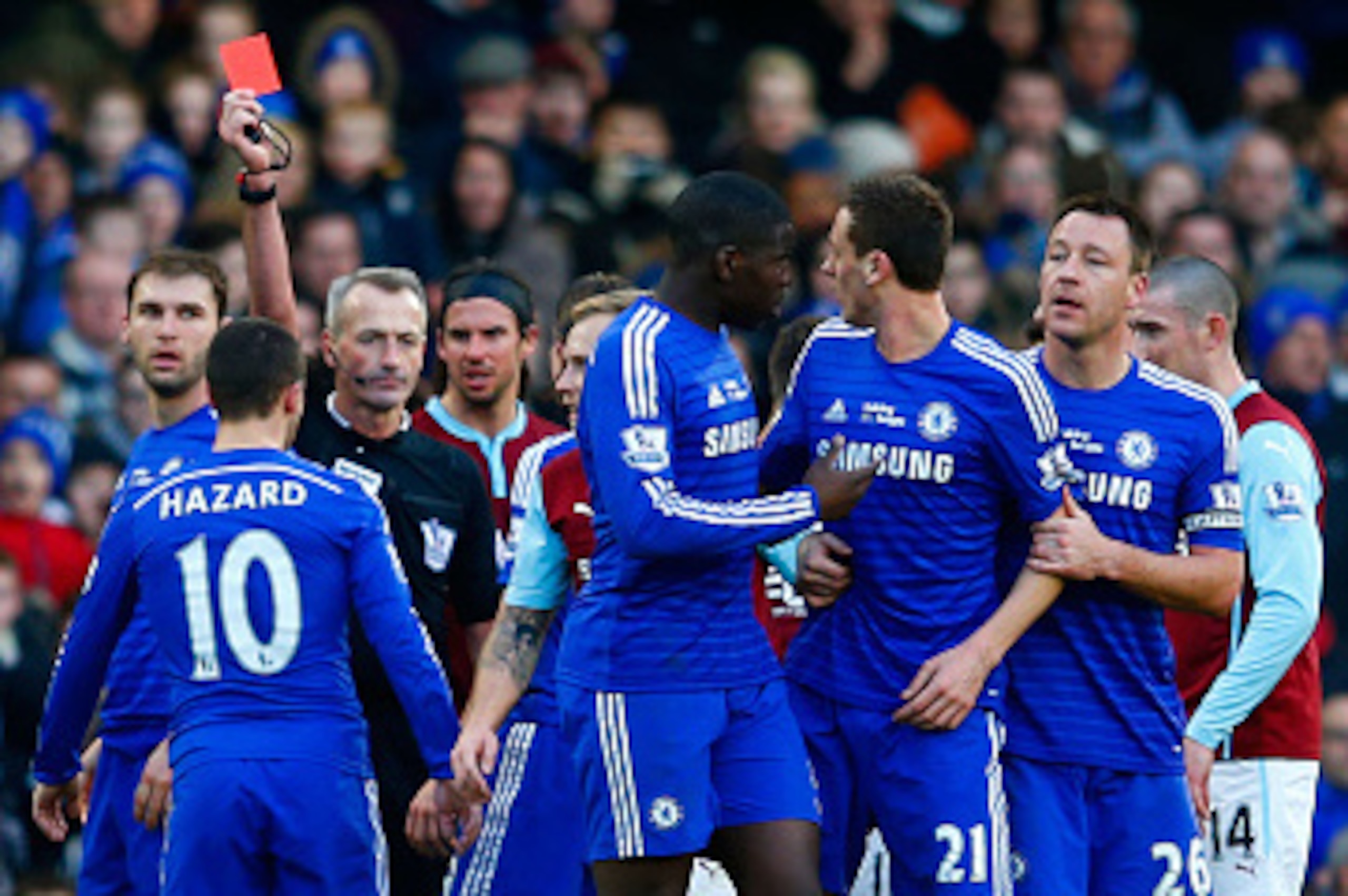 LONDON, ENGLAND - FEBRUARY 21: Referee Martin Atkinson shows the red card to Nemanja Matic of Chelsea for his reaction to the tackle by Ashley Barnes of Burnley during the Barclays Premier League match between Chelsea and Burnley at Stamford Bridge on Fe LONDON, ENGLAND - FEBRUARY 21: Referee Martin Atkinson shows the red card to Nemanja Matic of Chelsea for his reaction to the tackle by Ashley Barnes of Burnley during the Barclays Premier League match between Chelsea and Burnley at Stamford Bridge on Fe