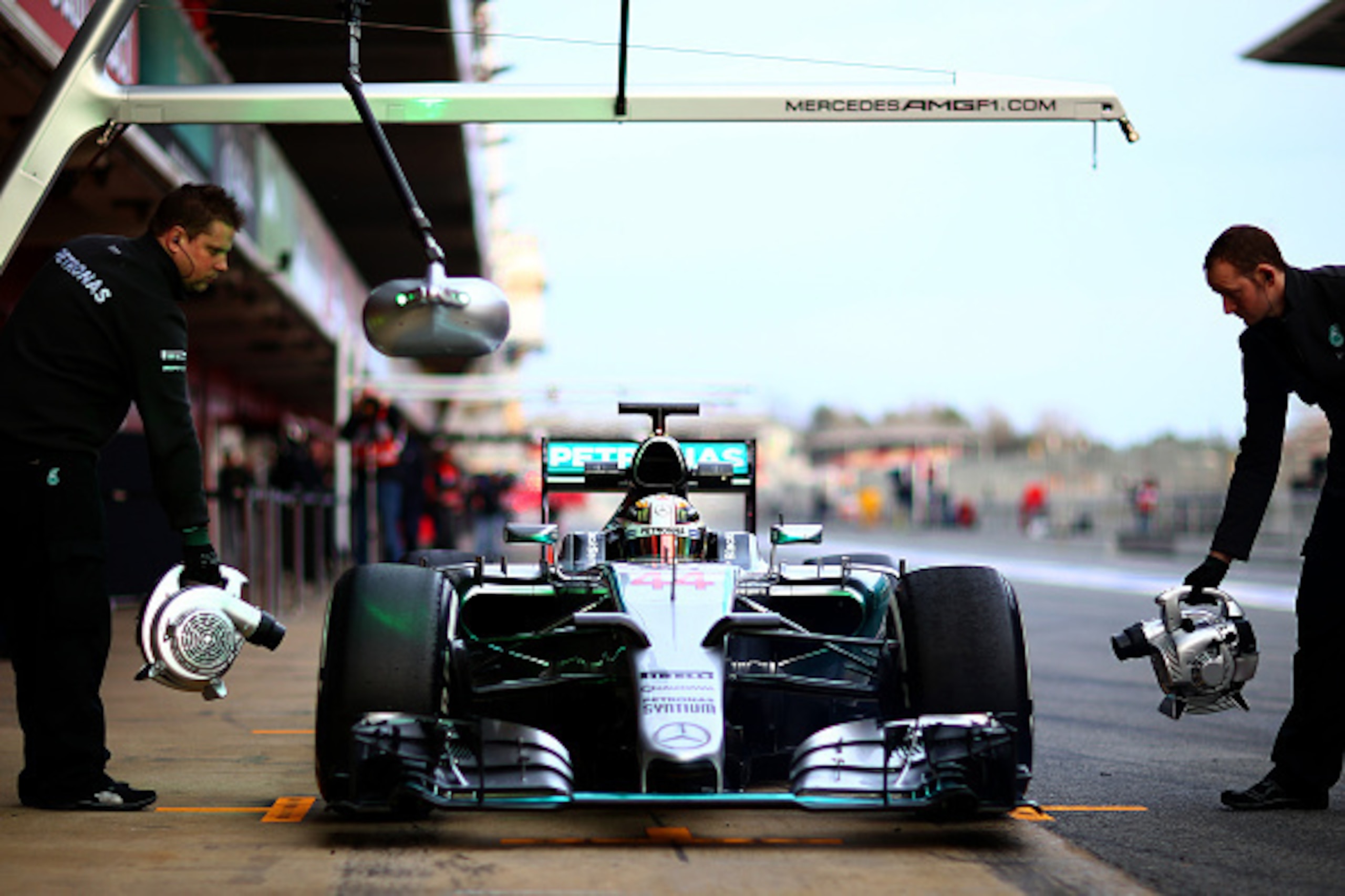 MONTMELO, SPAIN - FEBRUARY 21:  Lewis Hamilton of Great Britain and Mercedes GP returns to the garage during day three of Formula One Winter Testing at Circuit de Catalunya on February 21, 2015 in Montmelo, Spain.  (Photo by Mark Thompson/Getty Images)
