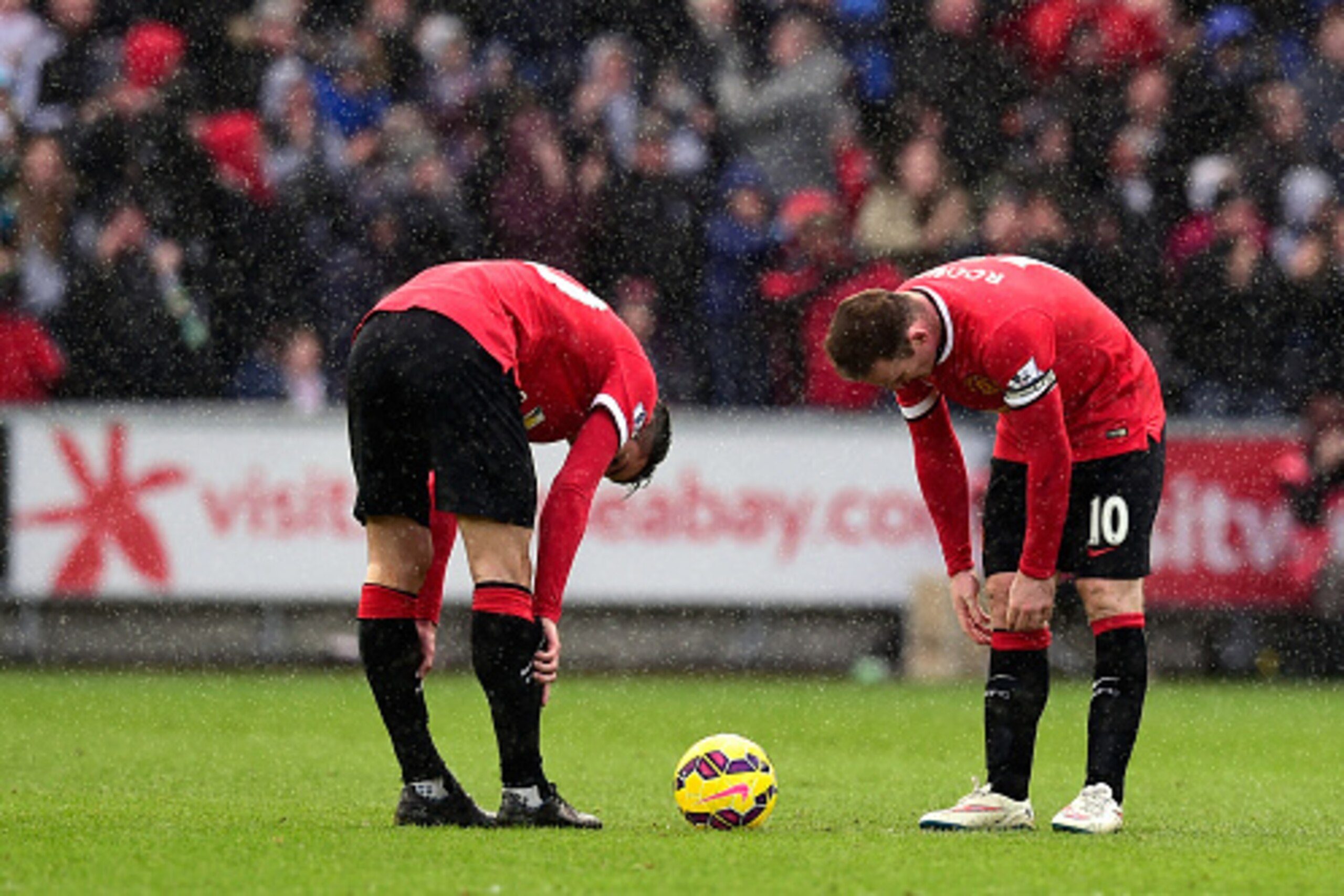 SWANSEA, WALES - FEBRUARY 21: Robin Van Persie (l) and Wayne Rooney of Manchester United react after the second Swansea goal during the Barclays Premier League match between Swansea City and Manchester United at Liberty Stadium on February 21, 2015 in Sw SWANSEA, WALES - FEBRUARY 21: Robin Van Persie (l) and Wayne Rooney of Manchester United react after the second Swansea goal during the Barclays Premier League match between Swansea City and Manchester United at Liberty Stadium on February 21, 2015 in Sw