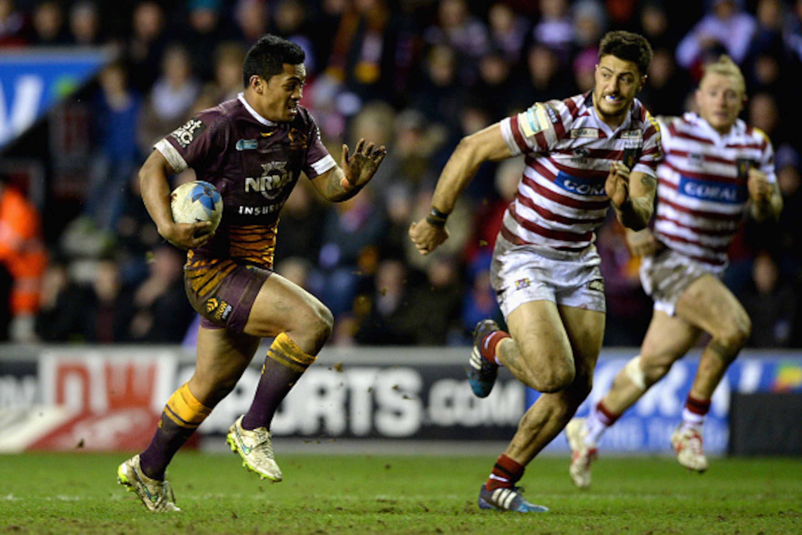 WIGAN, ENGLAND - FEBRUARY 21: Anthony Milford of Brisbane Broncos gets past Anthony Gelling of Wigan Warriors during the World Club Series match between Wigan Warriors and Brisbane Broncos at DW Stadium on February 21, 2015 in Wigan, England. (Photo by WIGAN, ENGLAND - FEBRUARY 21: Anthony Milford of Brisbane Broncos gets past Anthony Gelling of Wigan Warriors during the World Club Series match between Wigan Warriors and Brisbane Broncos at DW Stadium on February 21, 2015 in Wigan, England. (Photo by