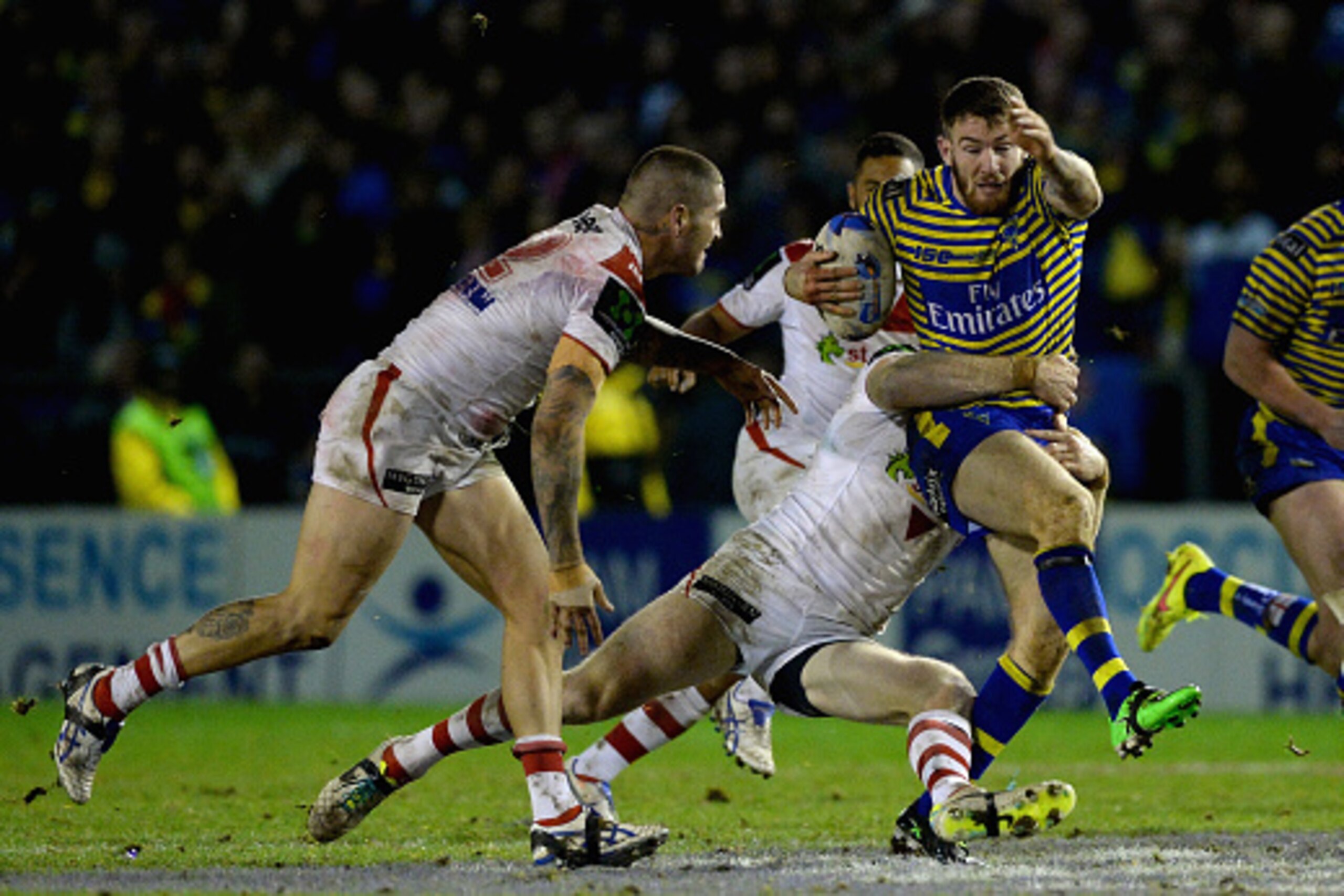 WARRINGTON, ENGLAND - FEBRUARY 20: Daryl Clark of Warrington Wolves is tackled by Josh Dugan of St George Illawarra Dragons during the World Club Series match between Warrington Wolves and St George Illawarra Dragons at The Halliwell Jones Stadium on Feb WARRINGTON, ENGLAND - FEBRUARY 20: Daryl Clark of Warrington Wolves is tackled by Josh Dugan of St George Illawarra Dragons during the World Club Series match between Warrington Wolves and St George Illawarra Dragons at The Halliwell Jones Stadium on Feb