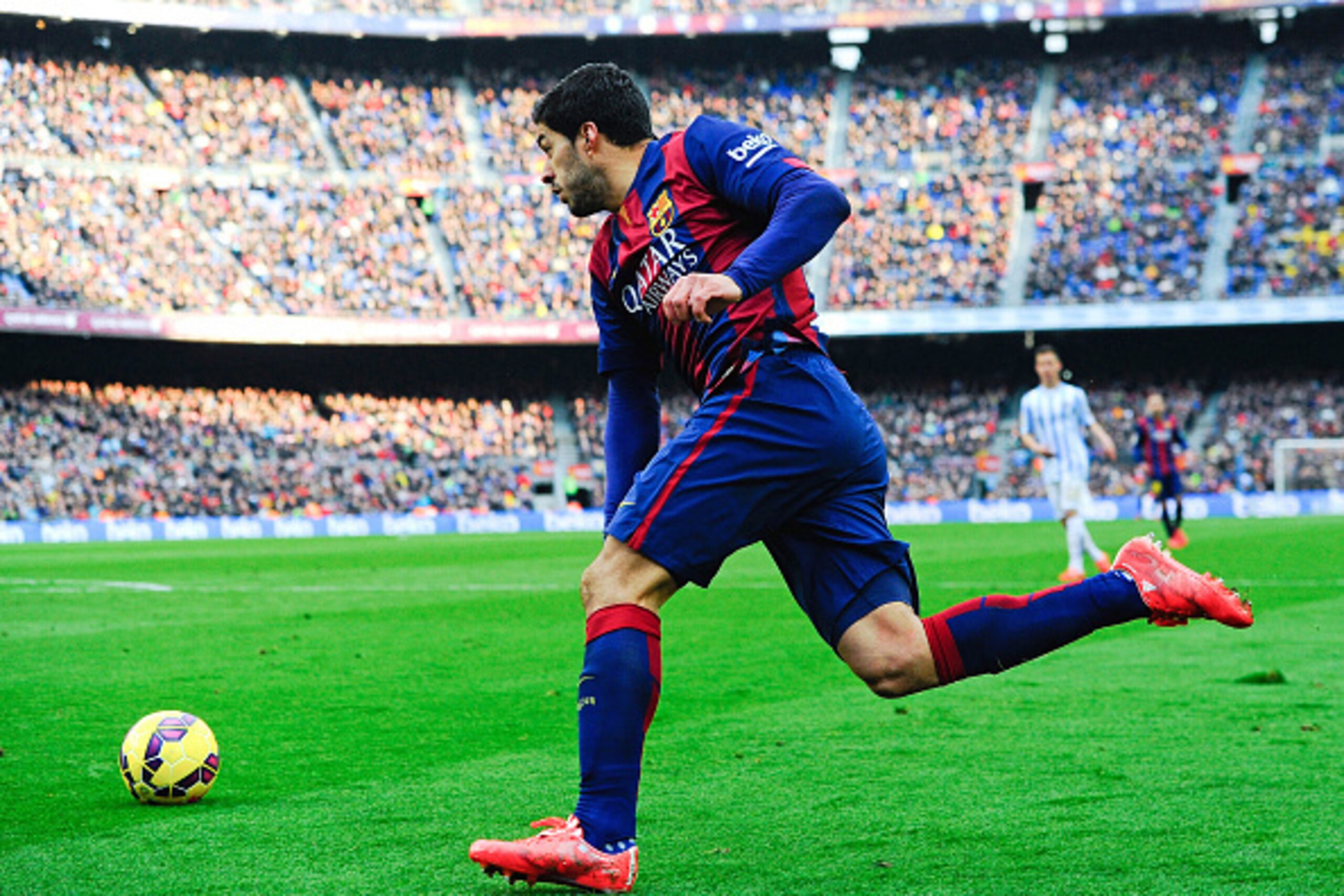 BARCELONA, SPAIN - FEBRUARY 21:  Luis Suarez of FC Barcelona runs with the ball during the La Liga match between FC Barcelona and Malaga CF at Camp Nou on February 21, 2015 in Barcelona, Spain.  (Photo by David Ramos/Getty Images)