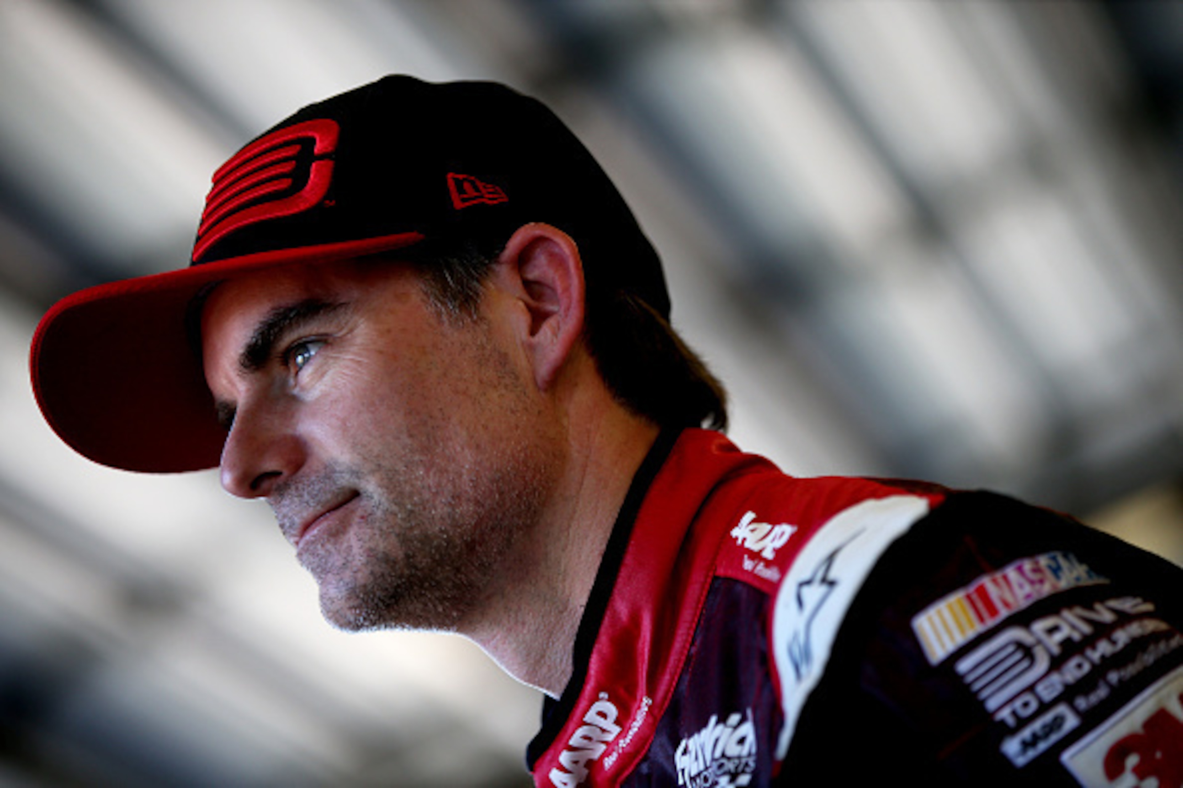 DAYTONA BEACH, FL - FEBRUARY 18:  Jeff Gordon, driver of the #24 Drive To End Hunger Chevrolet, looks on in the garage area during practice for the 57th Annual Daytona 500 at Daytona International Speedway on February 18, 2015 in Daytona Beach, Florida.  