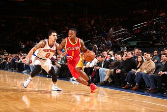 NEW YORK, NY - JANUARY 8:  Isaiah Canaan #0 of the Houston Rockets drives to the basket against Shane Larkin #0 of the New York Knicks on January 8, 2015 at Madison Square Garden in New York City.  NOTE TO USER: User expressly acknowledges and agrees that