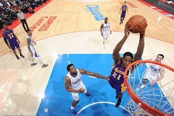 LOS ANGELES, CA - JANUARY 7:  Ed Davis #21 of the Los Angeles Lakers goes up for a dunk against the Los Angeles Clippers on January 7, 2015 at STAPLES Center in Los Angeles, California. NOTE TO USER: User expressly acknowledges and agrees that, by downloa