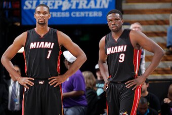 SACRAMENTO, CA - JANUARY 16: Chris Bosh #1 and Luol Deng #9 of the Miami Heat face off against the Sacramento Kings on January 16, 2015 at Sleep Train Arena in Sacramento, California. NOTE TO USER: User expressly acknowledges and agrees that, by downloadi