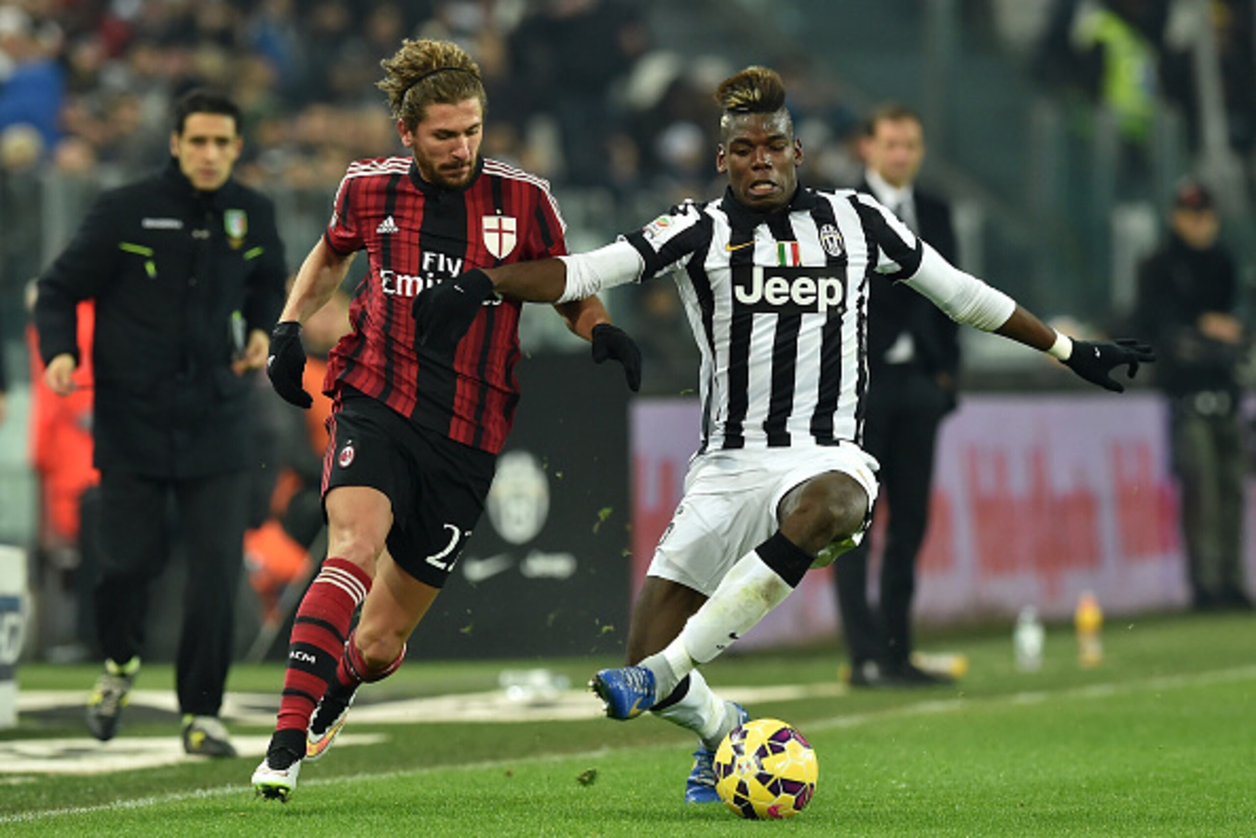 TURIN, ITALY - FEBRUARY 07:  Paul Pogba (R) of Juventus FC is challenged by Alessio Cerci of AC Milan during the Serie A match between Juventus FC and AC Milan at Juventus Arena on February 7, 2015 in Turin, Italy.  (Photo by Valerio Pennicino/Getty Image