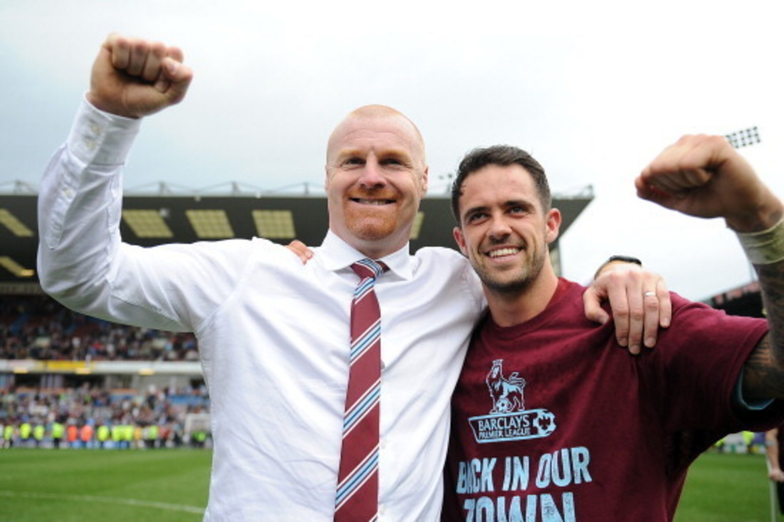 BURNLEY, ENGLAND - APRIL 21: Burnley manager Sean Dyche celebrates with Danny Ings following the Sky Bet Championship match between Burnley and Wigan Athletic at Turf Moor on April 21, 2014 in Burnley, England. (Photo by Chris Brunskill/Getty Images)