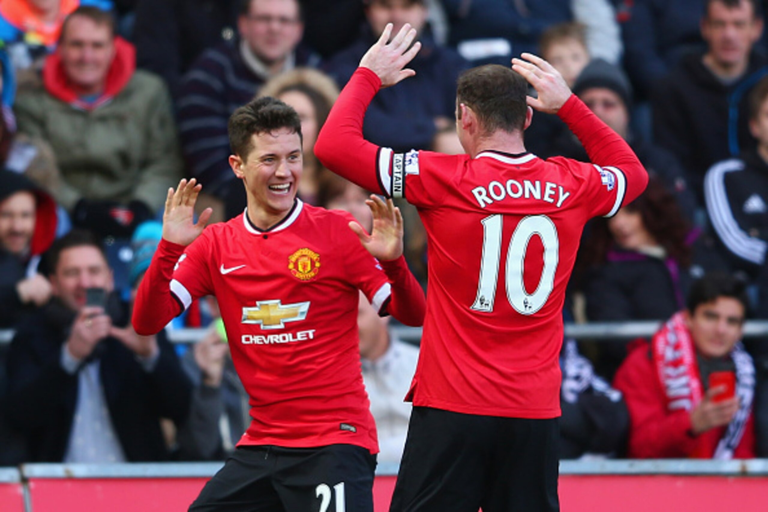 SWANSEA, WALES - FEBRUARY 21:  Ander Herrera of Manchester United celebrates scoring the opening goal with Wayne Rooney of Manchester United during the Barclays Premier League match between Swansea City and Manchester United at Liberty Stadium on February