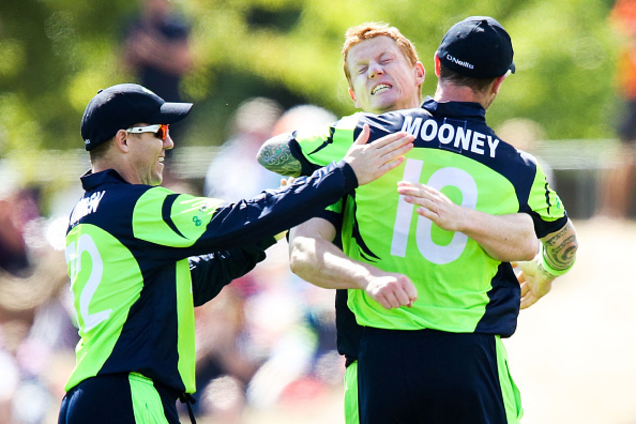 NELSON, NEW ZEALAND - FEBRUARY 16:  Kevin O'Brien of Ireland celebrates with teammates John Mooney and Niall O'Brien after taking the wicket of Dwayne Smith of the West Indies during the 2015 ICC Cricket World Cup match between the West Indies and Ireland