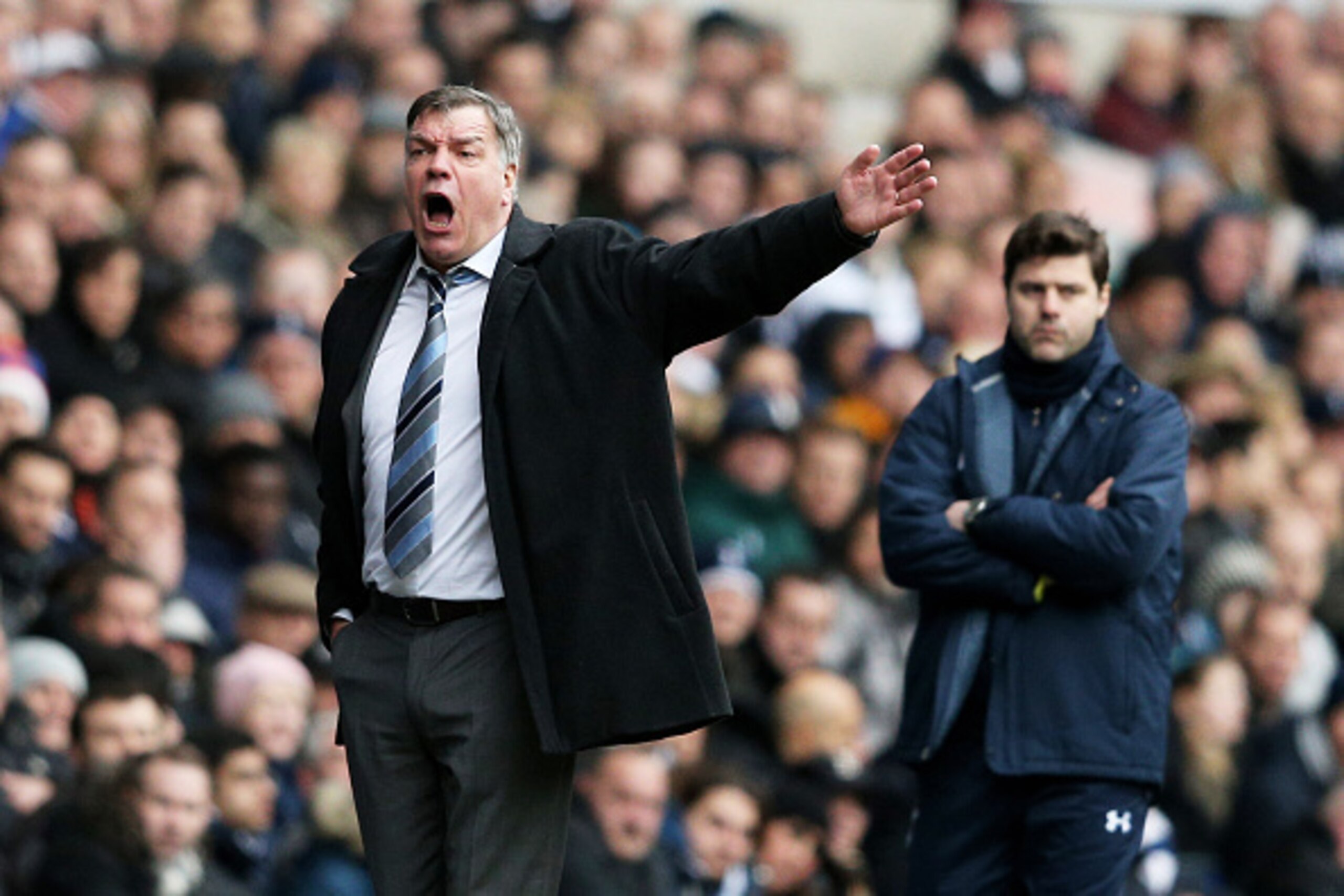 LONDON, ENGLAND - FEBRUARY 22:  Sam Allardyce the manager of West Ham directs his players as Mauricio Pochettino the manager of Spurs looks on during the Barclays Premier League match between Tottenham Hotspur and West Ham United at White Hart Lane on Feb
