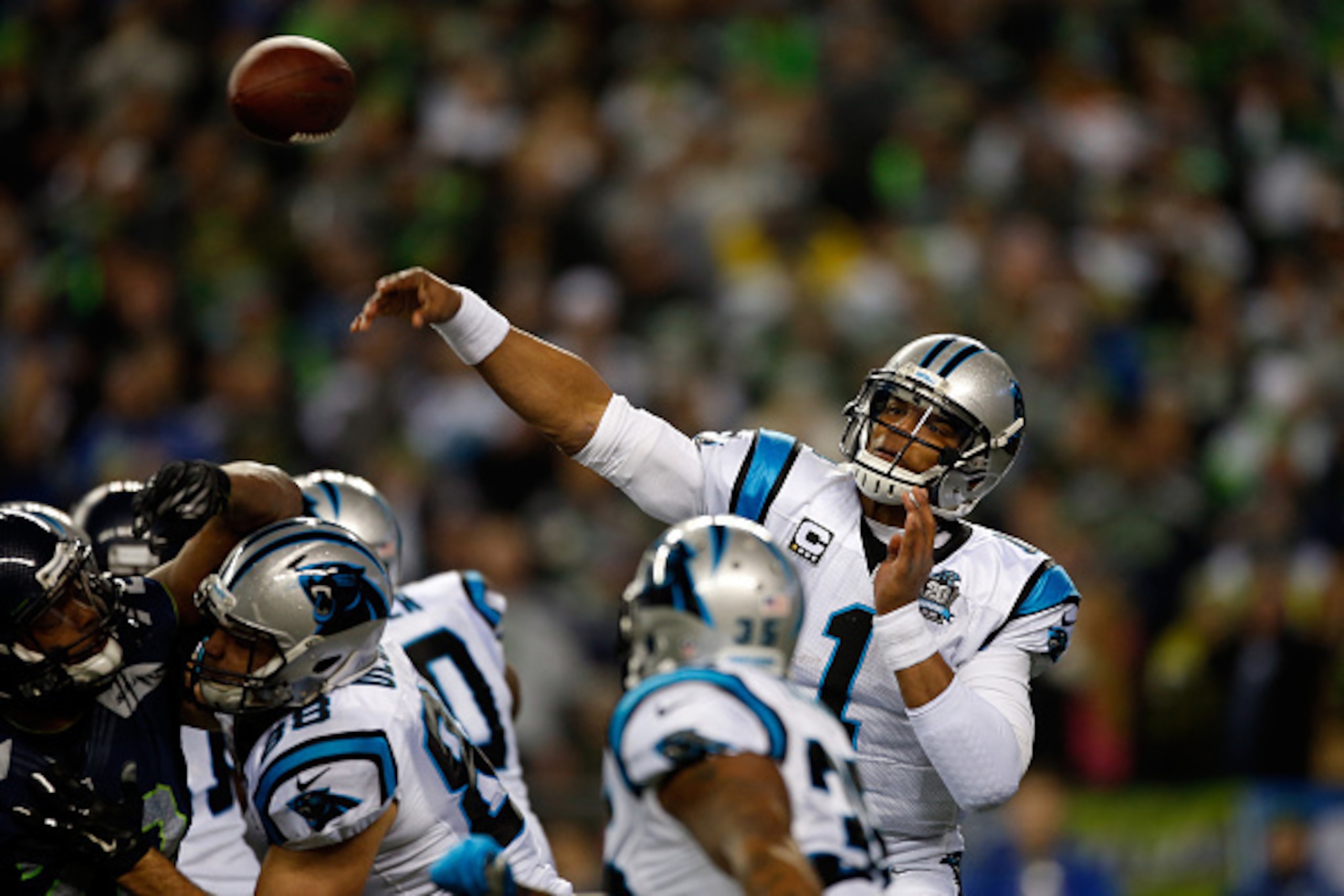 SEATTLE, WA - JANUARY 10:  Cam Newton #1 of the Carolina Panthers in action against the Seattle Seahawks during the 2015 NFC Divisional Playoff game at CenturyLink Field on January 10, 2015 in Seattle, Washington.  (Photo by Otto Greule Jr/Getty Images)