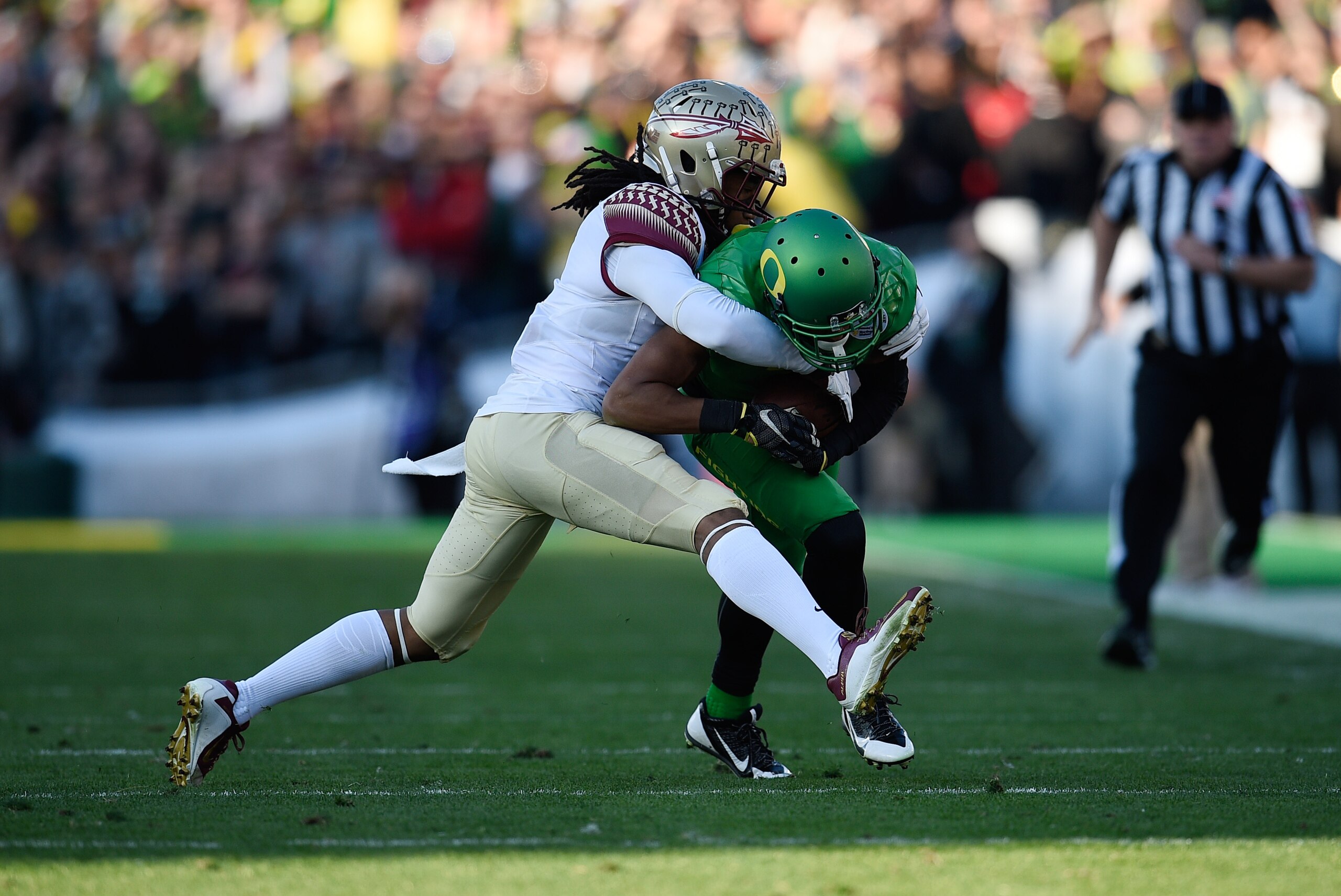 Jan 1, 2015; Pasadena, CA, USA; Oregon Ducks wide receiver Keanon Lowe (7) is tackled by Florida State Seminoles cornerback Ronald Darby (3) during the first half of the 2015 Rose Bowl college football game at Rose Bowl. Mandatory Credit: Kelvin Kuo-USA T