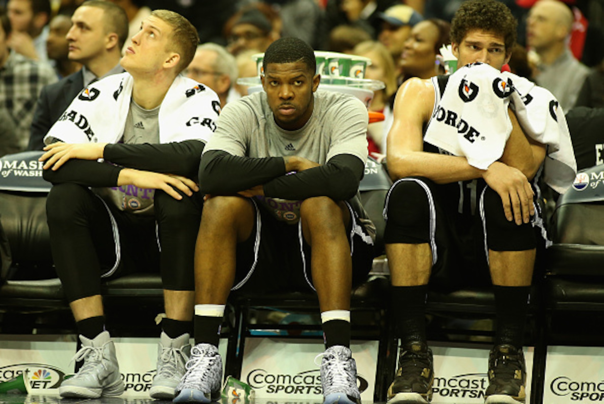WASHINGTON, DC - FEBRUARY 07: Mason Plumlee #1 (L) Joe Johnson #7 (C) and Brook Lopez #11 of the Brooklyn Nets sit on the bench during the closing minutes of their 114-77 loss to the Washington Wizards at Verizon Center on February 7, 2015 in Washington, 