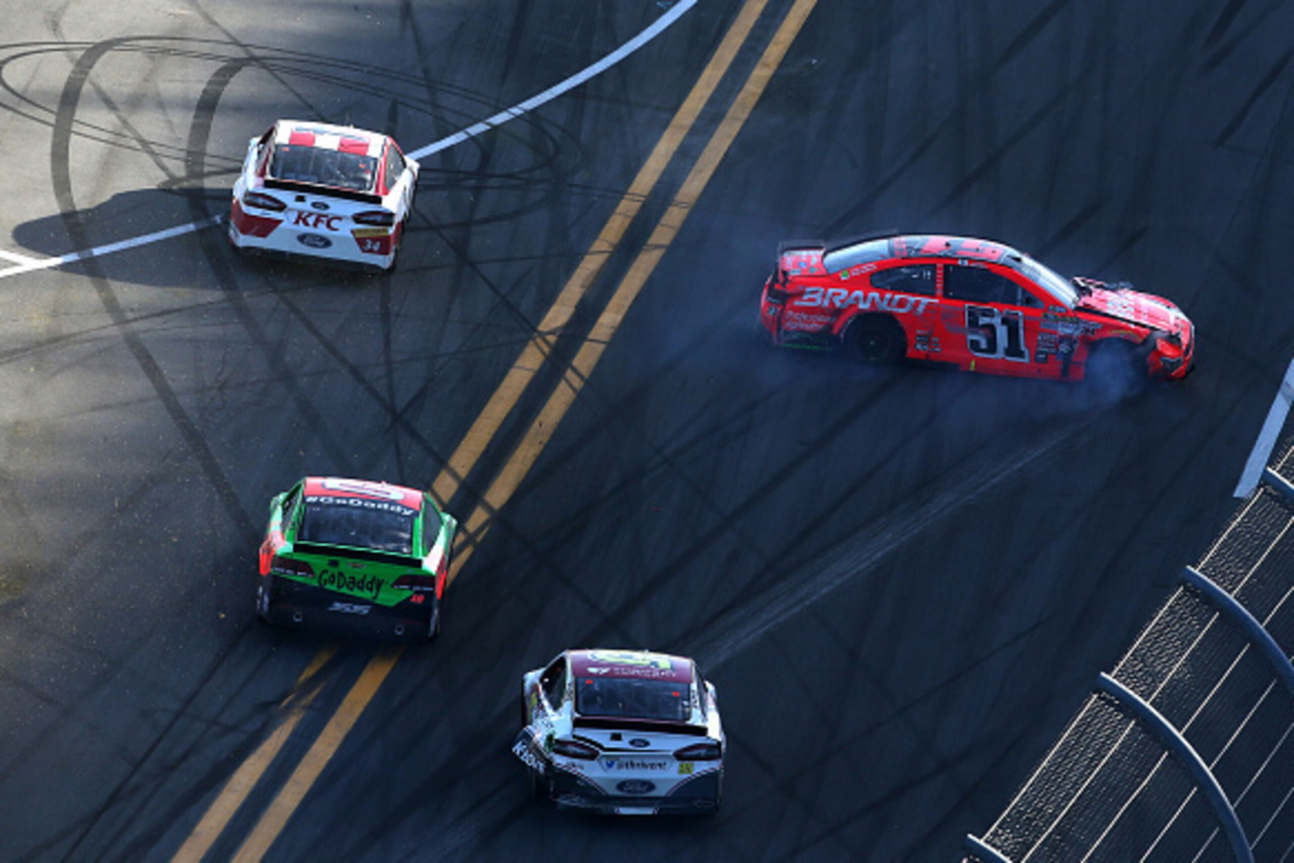 DAYTONA BEACH, FL - FEBRUARY 22:  Justin Allgaier, driver of the #51 Brandt Chevrolet, spins on track during the NASCAR Sprint Cup Series 57th Annual Daytona 500 at Daytona International Speedway on February 22, 2015 in Daytona Beach, Florida.  (Photo by 