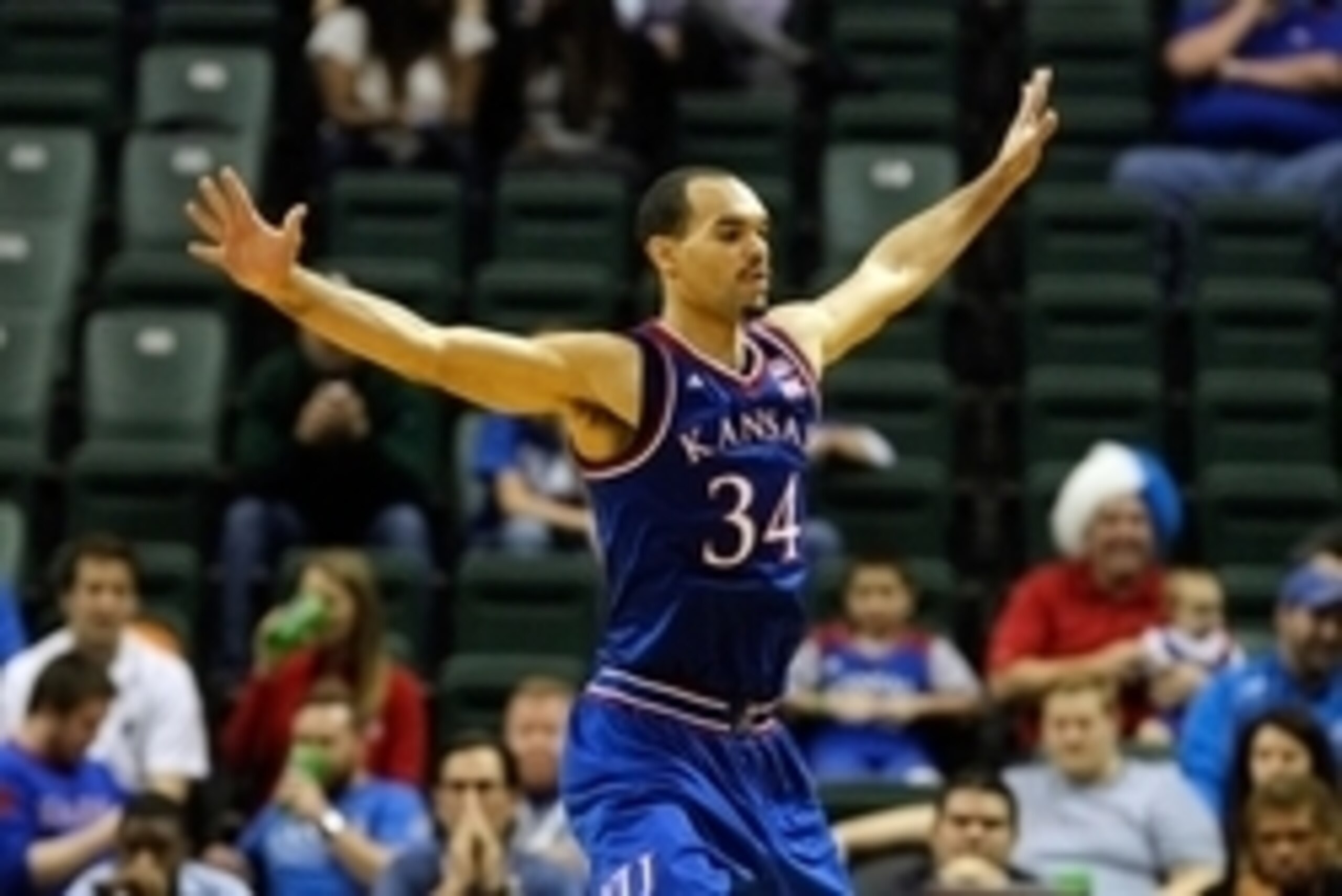 Nov 27, 2014; Kissimmee, FL, USA; Kansas Jayhawks forward Perry Ellis (34) defends against the Rhode Island Rams during the second half at HP Field house at Wide World of Sports Complex. Kansas Jayhawks defeated the Rhode Island Rams 76-60. Mandatory Cred Nov 27, 2014; Kissimmee, FL, USA; Kansas Jayhawks forward Perry Ellis (34) defends against the Rhode Island Rams during the second half at HP Field house at Wide World of Sports Complex. Kansas Jayhawks defeated the Rhode Island Rams 76-60. Mandatory Cred