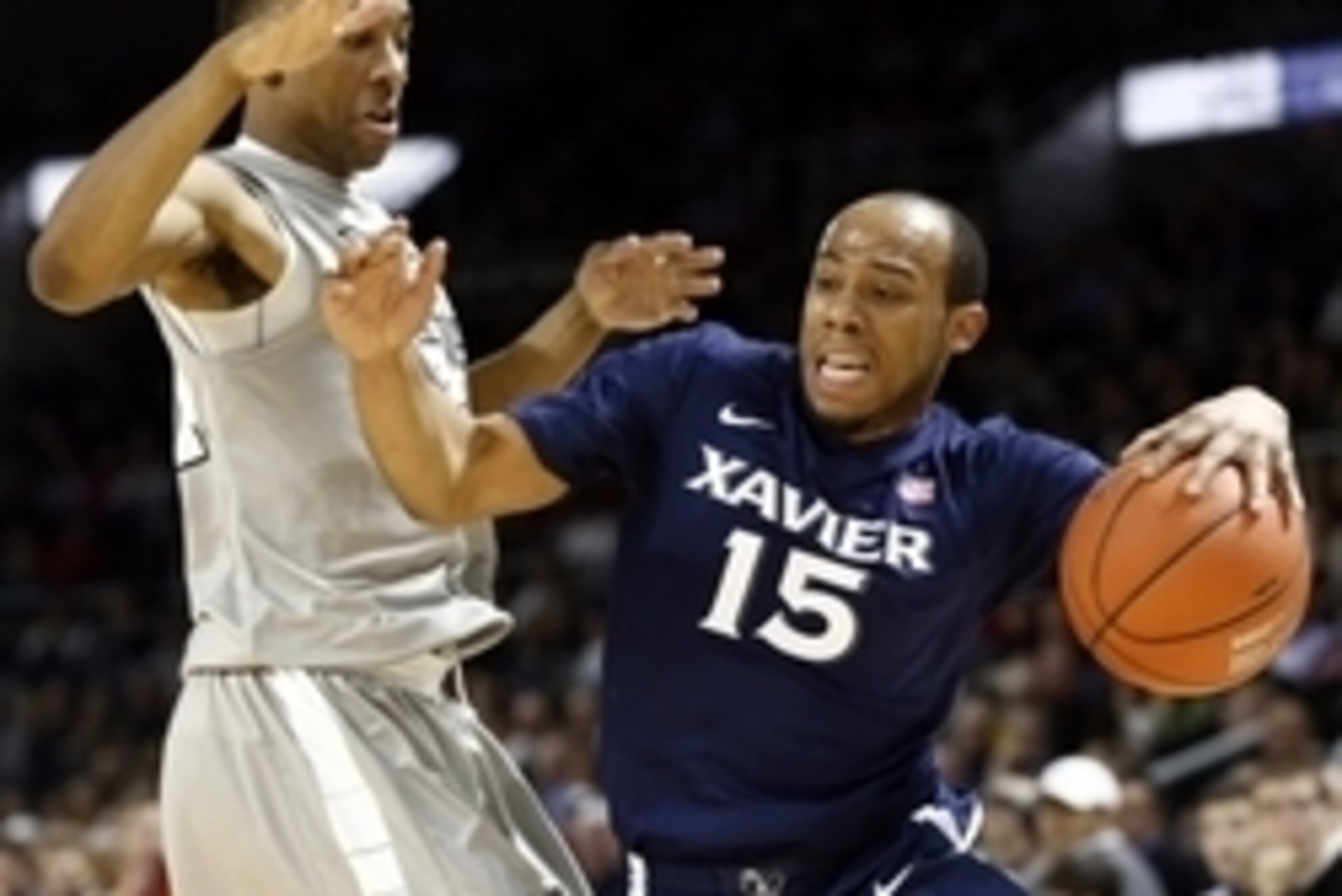Jan 22, 2015; Providence, RI, USA; Xavier Musketeers guard Myles Davis (15) drives to the hoop against Providence Friars guard Jalen Lindsey (left) during the second half at Dunkin Donuts Center. Mandatory Credit: Mark L. Baer-USA TODAY Sports Jan 22, 2015; Providence, RI, USA; Xavier Musketeers guard Myles Davis (15) drives to the hoop against Providence Friars guard Jalen Lindsey (left) during the second half at Dunkin Donuts Center. Mandatory Credit: Mark L. Baer-USA TODAY Sports