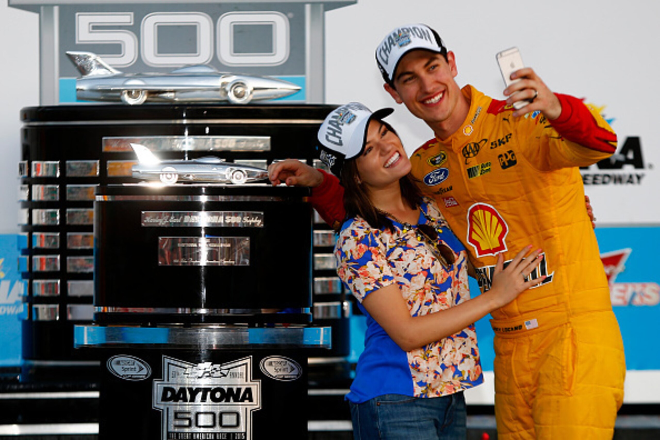 DAYTONA BEACH, FL - FEBRUARY 22: Joey Logano, driver of the #22 Shell Pennzoil Ford, and wife Brittany take a selfie in Victory Lane with The Harley J. Earl Trophy after winning the NASCAR Sprint Cup Series 57th Annual Daytona 500 at Daytona Internationa DAYTONA BEACH, FL - FEBRUARY 22: Joey Logano, driver of the #22 Shell Pennzoil Ford, and wife Brittany take a selfie in Victory Lane with The Harley J. Earl Trophy after winning the NASCAR Sprint Cup Series 57th Annual Daytona 500 at Daytona Internationa