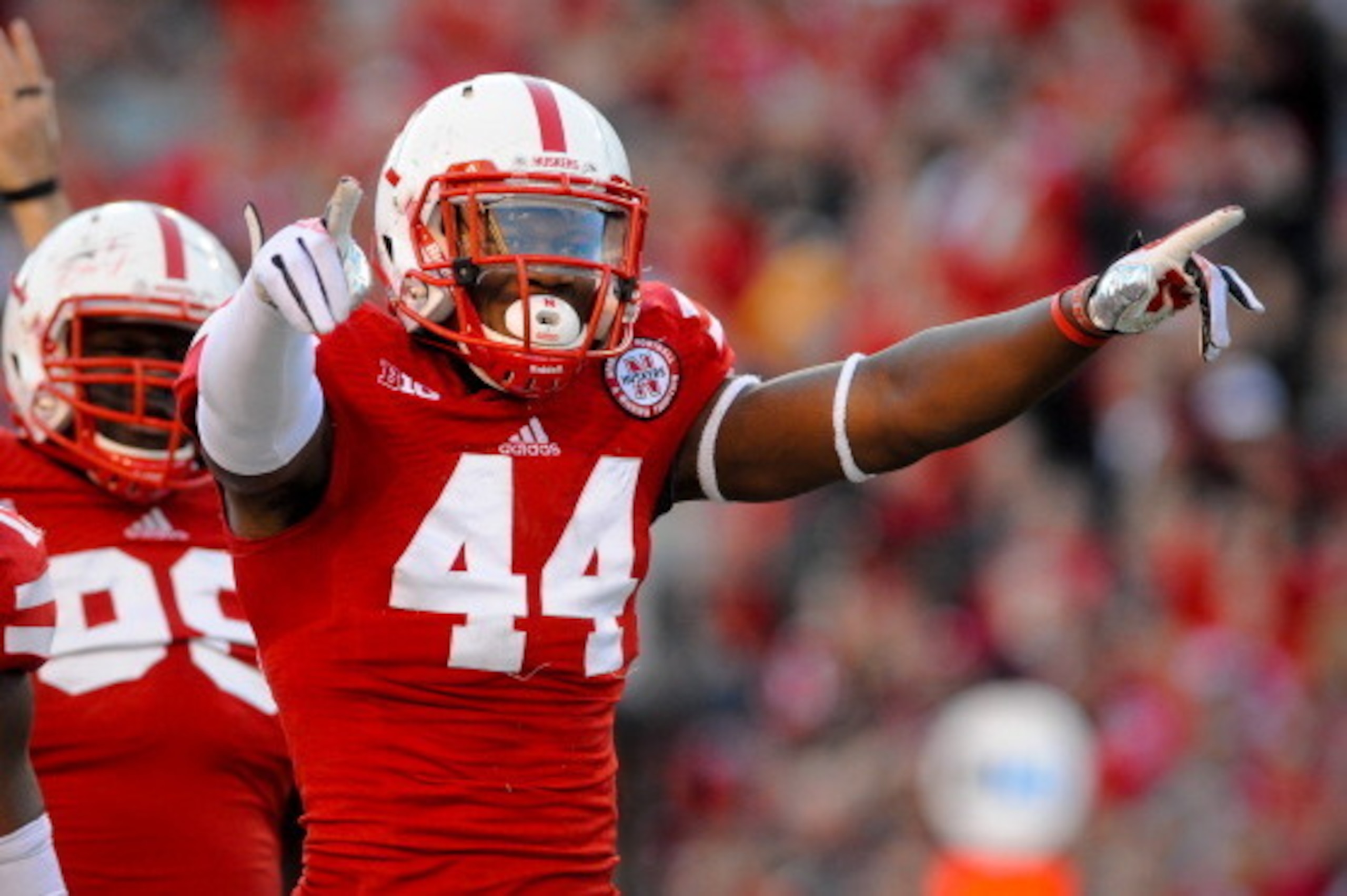 LINCOLN, NE - NOVEMBER 16: Defensive end Randy Gregory #44 of the Nebraska Cornhuskers reacts after a tackle during their game at against the Michigan State Spartans Memorial Stadium on November 16, 2013 in Lincoln, Nebraska. (Photo by Eric Francis/Getty 