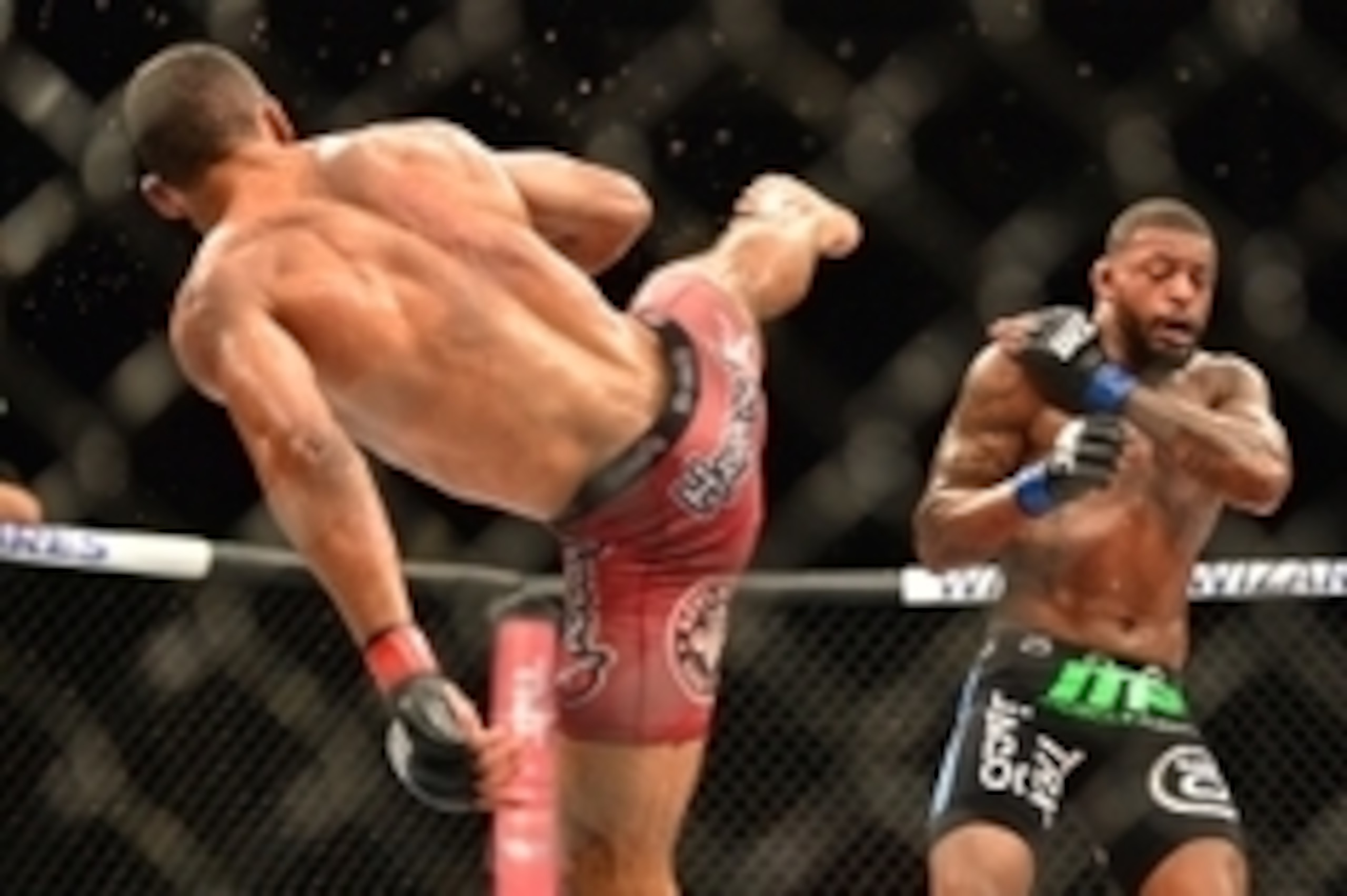 Feb 22, 2015; Porto Alegre, Brazil; Michael Johnson (blue gloves) fights against Edson Barboza (red gloves) during UFC Fight Night at Ginasio do Gigantinho. Mandatory Credit: Jason da Silva-USA TODAY Sports
