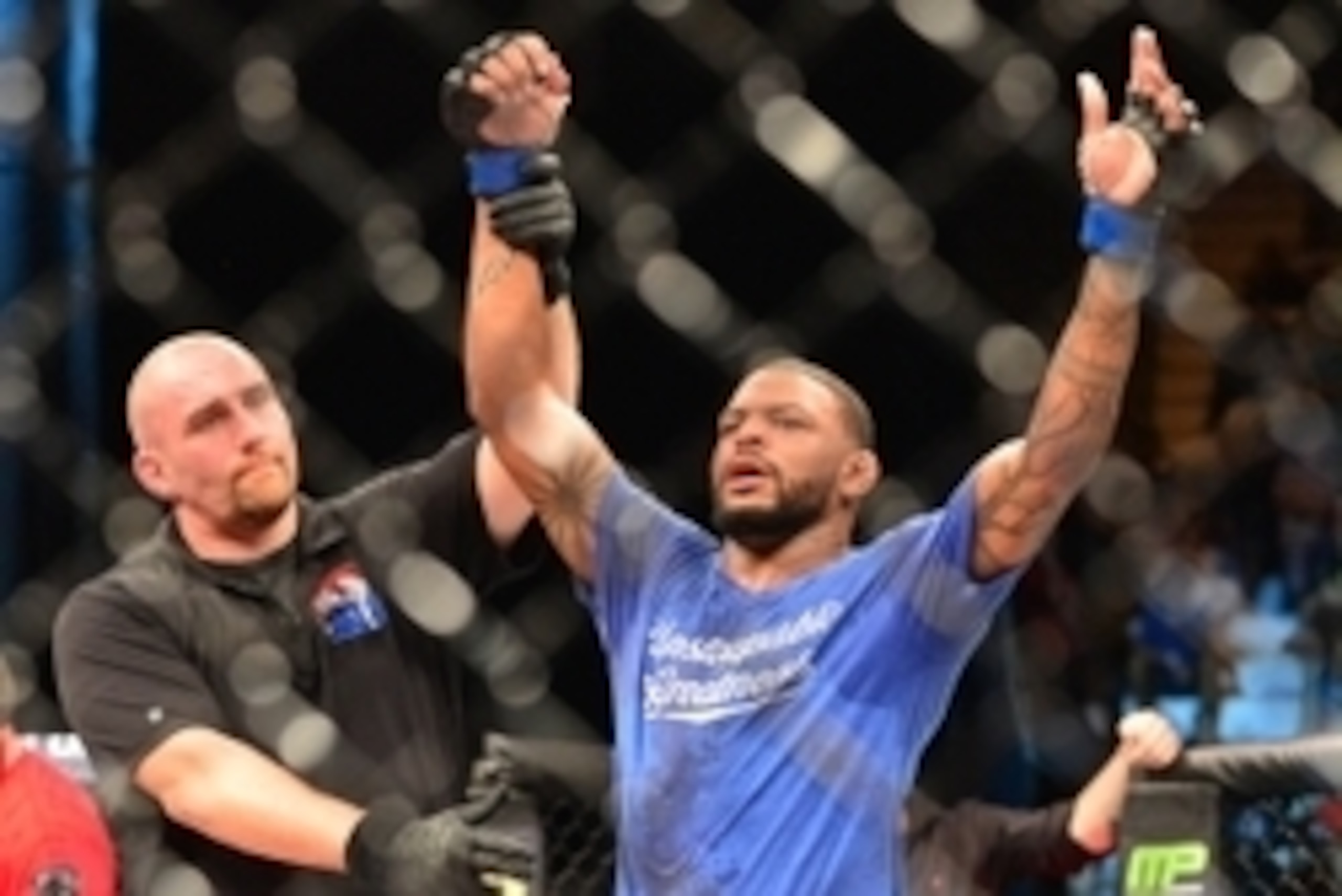 Feb 22, 2015; Porto Alegre, Brazil; Michael Johnson (blue gloves) celebrates after his fight against Edson Barboza (red gloves) during UFC Fight Night at Ginasio do Gigantinho. Mandatory Credit: Jason da Silva-USA TODAY Sports