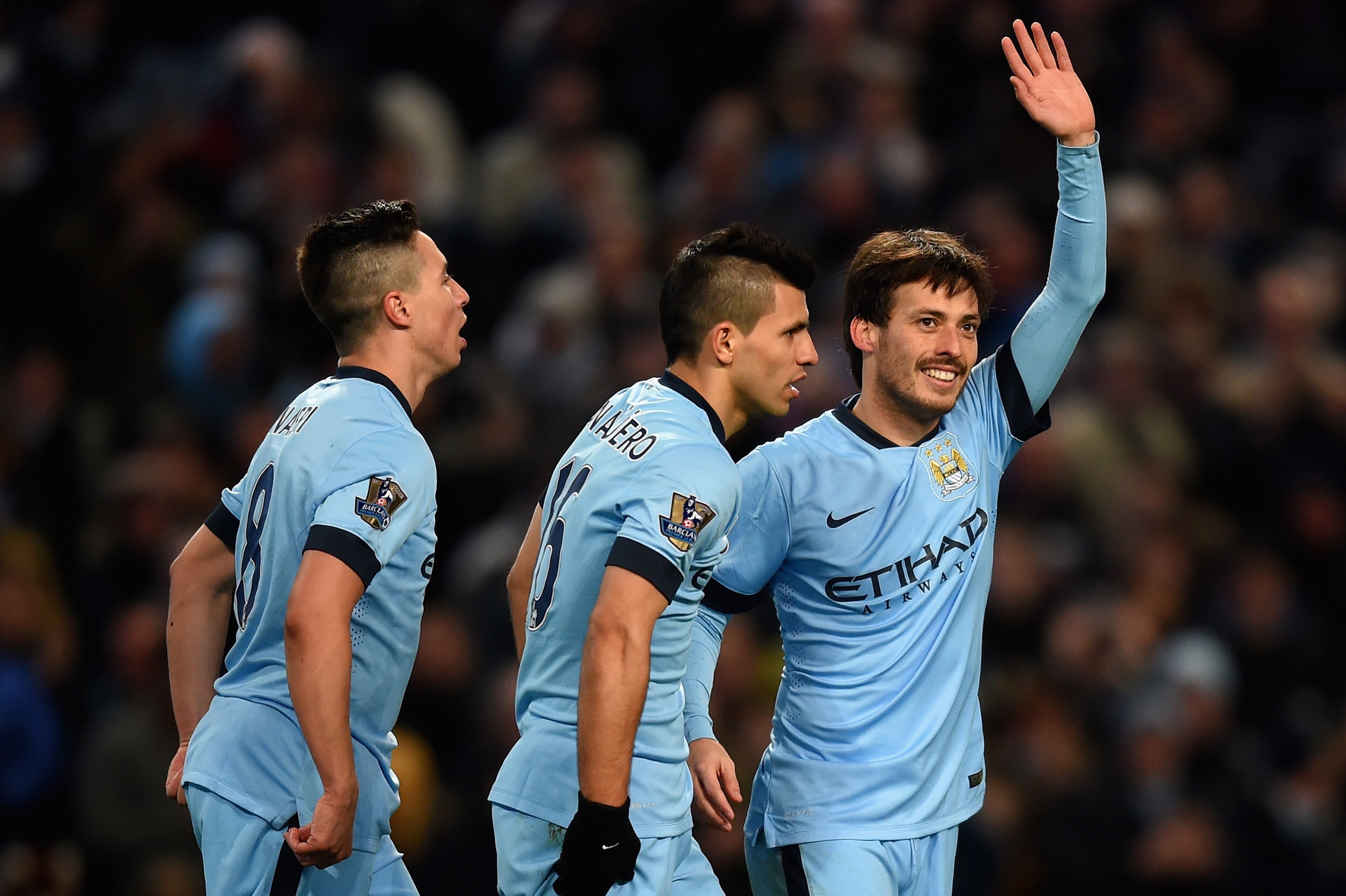 MANCHESTER, ENGLAND - FEBRUARY 21: David Silva of Manchester City celebrates scoring their fourth goal during the Barclays Premier League match between Manchester City and Newcastle United at Etihad Stadium on February 21, 2015 in Manchester, England.  (P