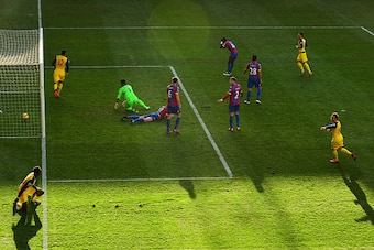 LONDON, ENGLAND - FEBRUARY 21:  Olivier Giroud of Arsenal (12) celebrates as he scores their second goal past goalkeeper Julian Speroni of Crystal Palace during the Barclays Premier League match between Crystal Palace and Arsenal at Selhurst Park on Febru