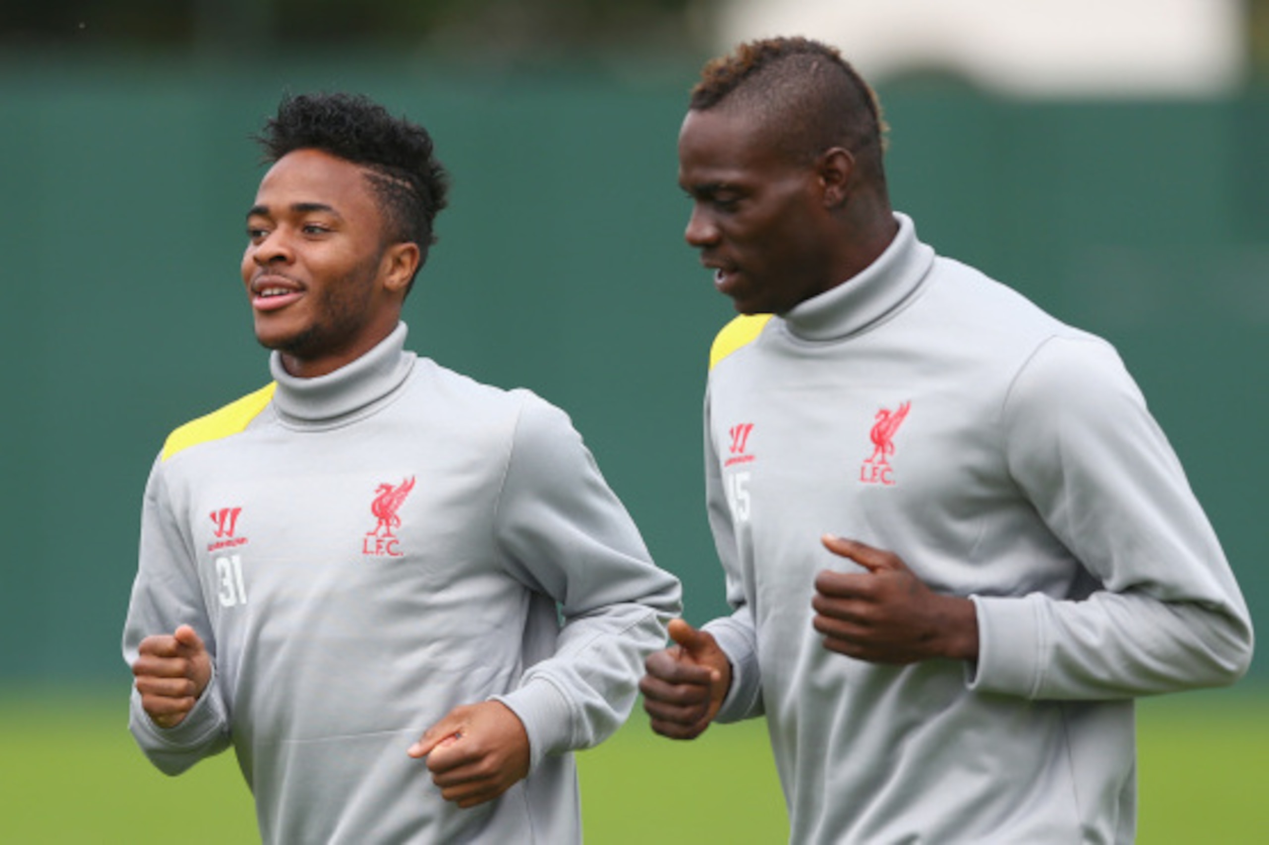 LIVERPOOL, ENGLAND - SEPTEMBER 15:  Mario Balotelli and team mate Raheem Sterling of Liverpool warm up for a during a training session ahead of their UEFA Champions League group B match against PFC Ludogorets on September 15, 2014 in Liverpool, United Kin