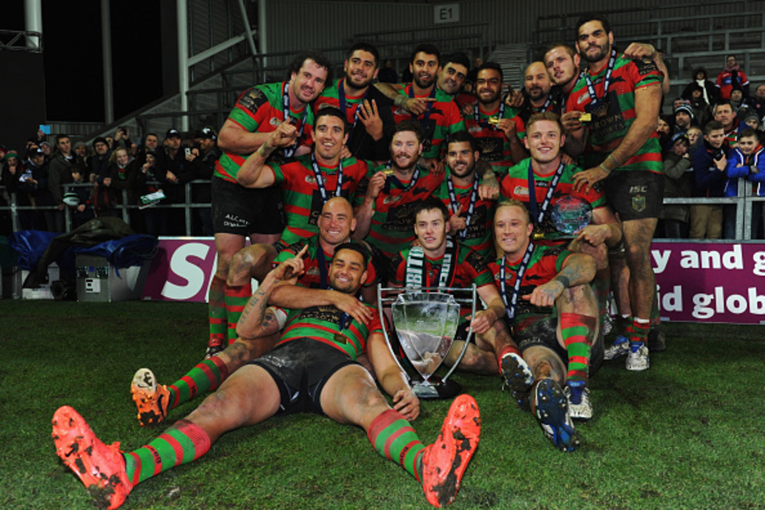 ST HELENS, ENGLAND - FEBRUARY 22: South Sydney Rabbitohs celebrate with the trophy after victory in the World Club Challenge match between St Helens and South Sydney Rabbitohs at Langtree Park on February 22, 2015 in St Helens, England. The match is the ST HELENS, ENGLAND - FEBRUARY 22: South Sydney Rabbitohs celebrate with the trophy after victory in the World Club Challenge match between St Helens and South Sydney Rabbitohs at Langtree Park on February 22, 2015 in St Helens, England. The match is the