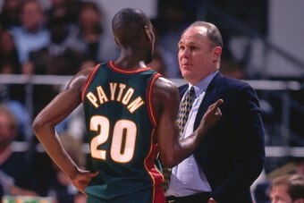 OAKLAN, CA - 1996: Gary Payton #20 talks with Seattle Supersonics head coach George Karl against the Golden State Warriors circa 1996 at the Oakland-Alameda County Coliseum Arena in Oakland, California. NOTE TO USER: User expressly acknowledges and agrees