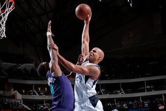 DALLAS, TX - FEBRUARY 22: Richard Jefferson #24 of the Dallas Mavericks goes in for the dunk against Michael Kidd-Gilchrist #14 of the Charlotte Hornets on February 22, 2015 at the American Airlines Center in Dallas, Texas. NOTE TO USER: User expressly ac