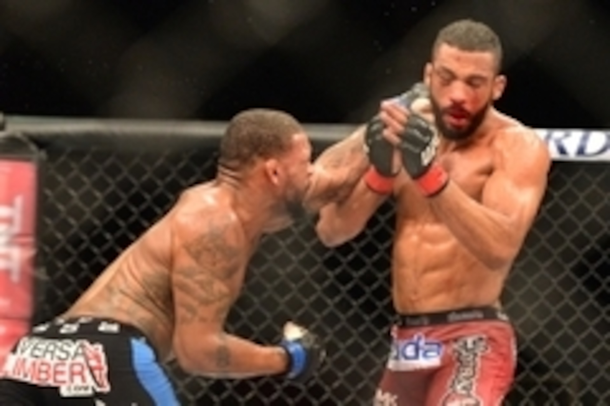 Feb 22, 2015; Porto Alegre, Brazil; Michael Johnson (blue gloves) fights against Edson Barboza (red gloves) during UFC Fight Night at Ginasio do Gigantinho. Mandatory Credit: Jason da Silva-USA TODAY Sports